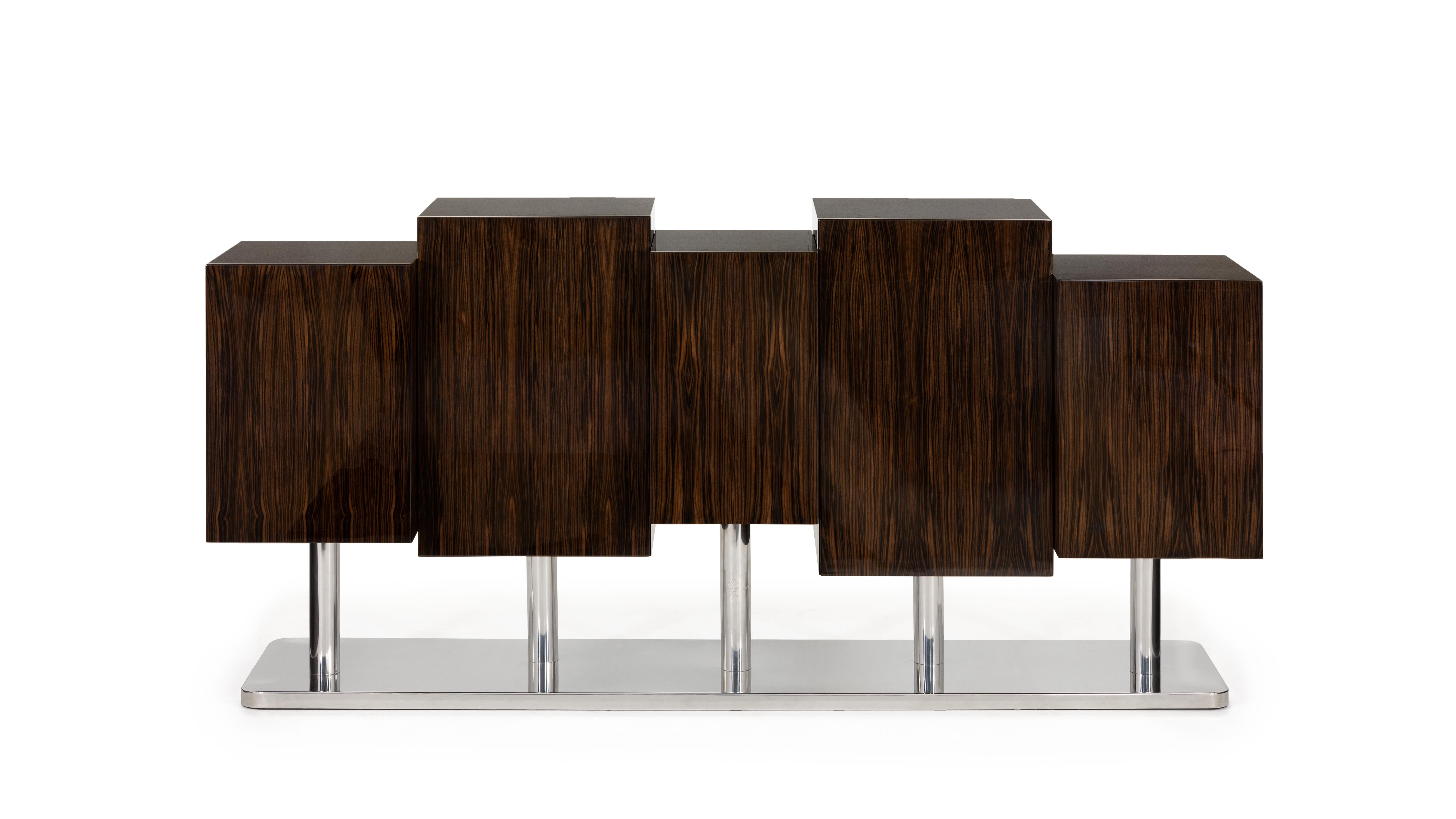 The Special Tree Sideboard by InsidherLand
Dimensions: D 53 x W 200 x H 95 cm.
Materials: 
Wooden structure: Ebony Macassar. Shelves: glass. Base, tubes, and shelf supports: polished stainless steel.
130 kg.

The Special Tree sideboard is a redesign