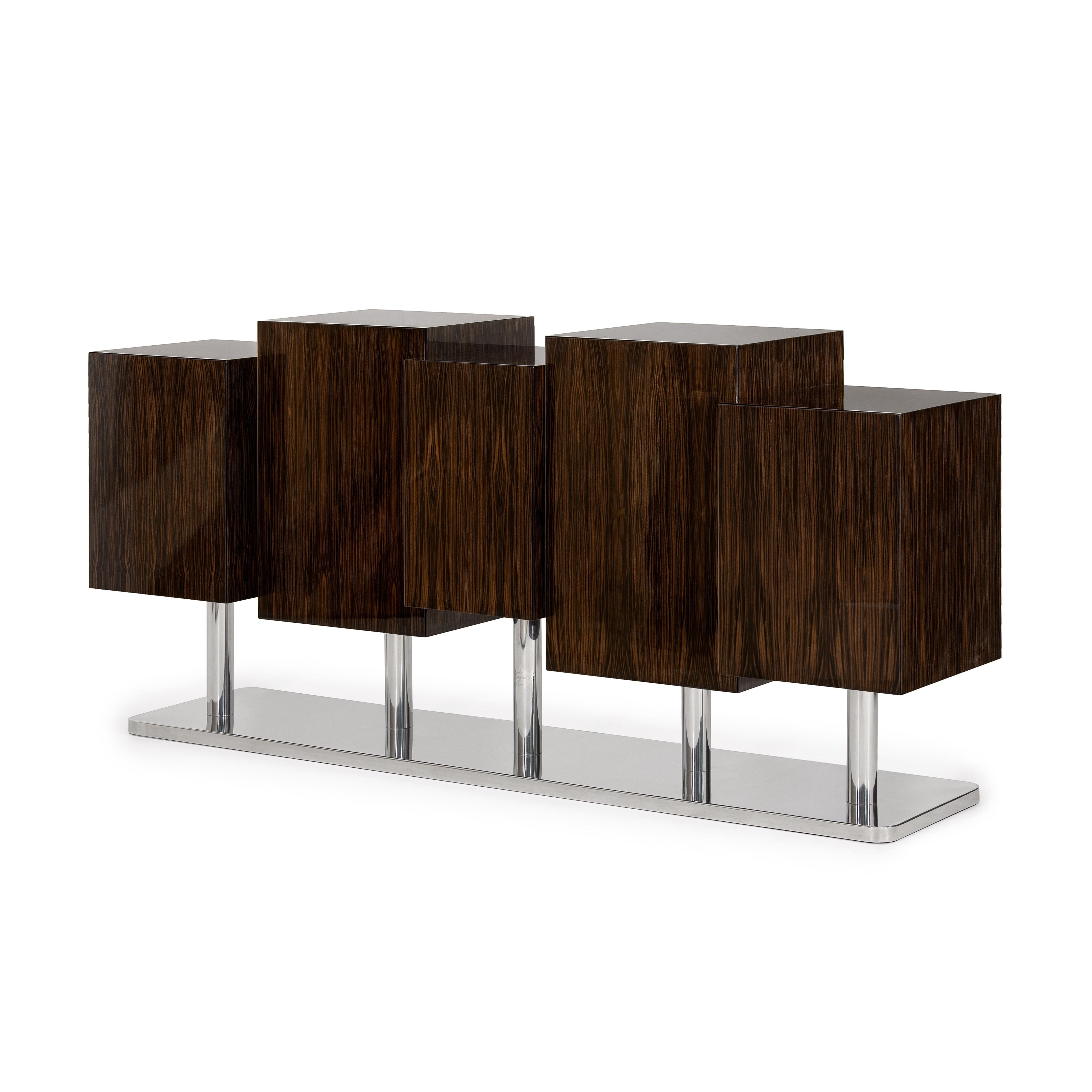 The special tree is a tree in which two lovers write the promise of an everlasting love.
The special tree sideboard is a redesign of the original cabinet. A singular version of this sideboard is presented in ebony Macassar, showing the geometric