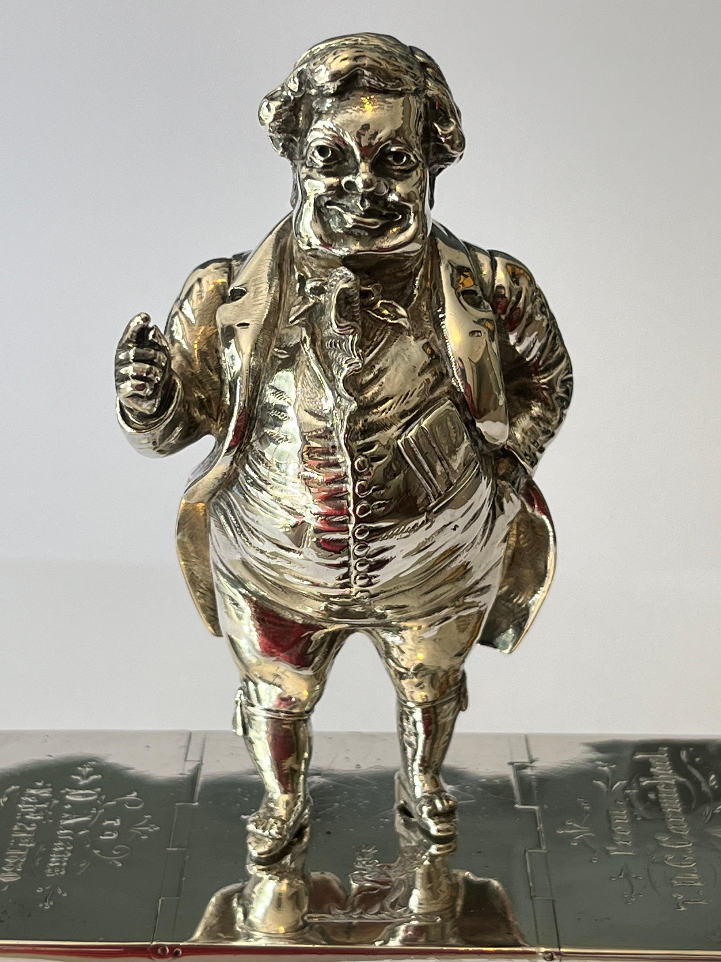 The Sporting lecture.
 
An extremely fine Victorian silver novelty cruet set, comprising a heavy gauge cast figural pepper modelled as the popular fictional comic sporting character, John Jorrocks Esq., atop a rectangular base with Dual hinged