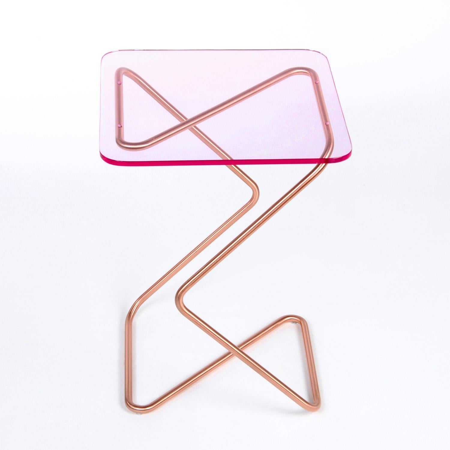 The square side table by Rita Kettaneh 
Dimensions: The base: brushed stainless steel plated with copper 
 optionally plated with copper or brass
 The top: acrylic
Materials: H 46 x W 33 x D 33 cm
Weight: 3.75 Kg

Colors and finishes: