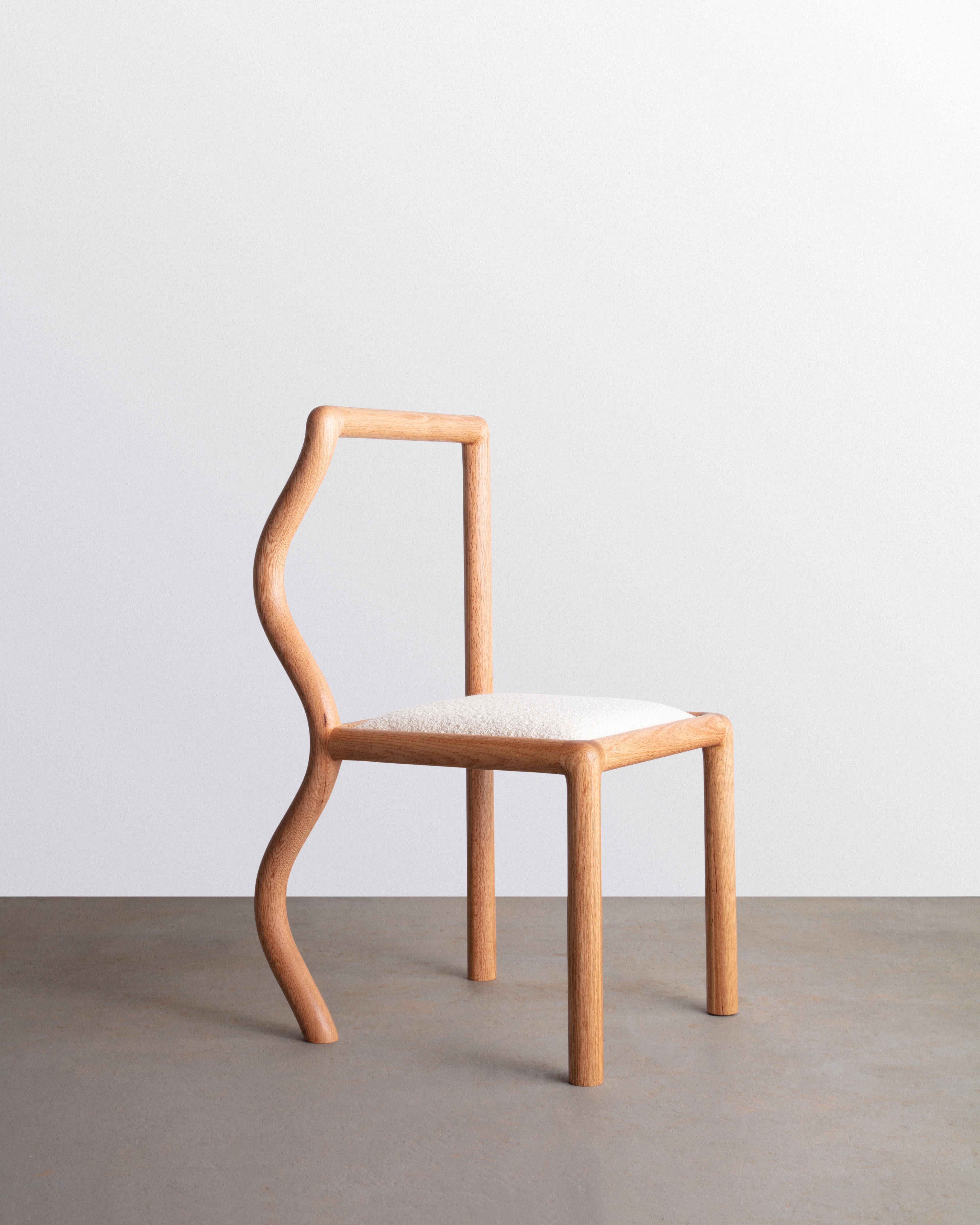 The Squiggle chair was created though an exploration of shaping solid Oak slab lumber. Designed to bring a smile to any space, each chair part is thoughtfully selected to highlight the grain pattern and characteristics of American Red Oak. The seat