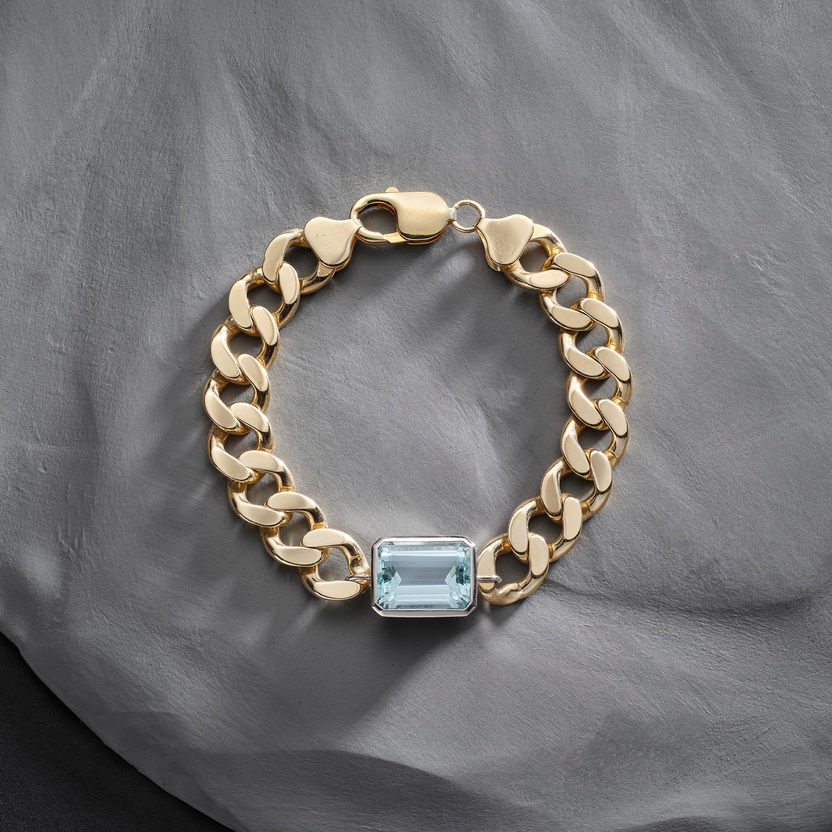 1970s 9ct gold curb chain, set with a 16.50ct emerald cut Aquamarine, in a platinum bezel setting.
Story: I can’t resist a heavy gold chain, and the masculine edge to this one is particularly wonderful when used to showcase this dreamy, crystal