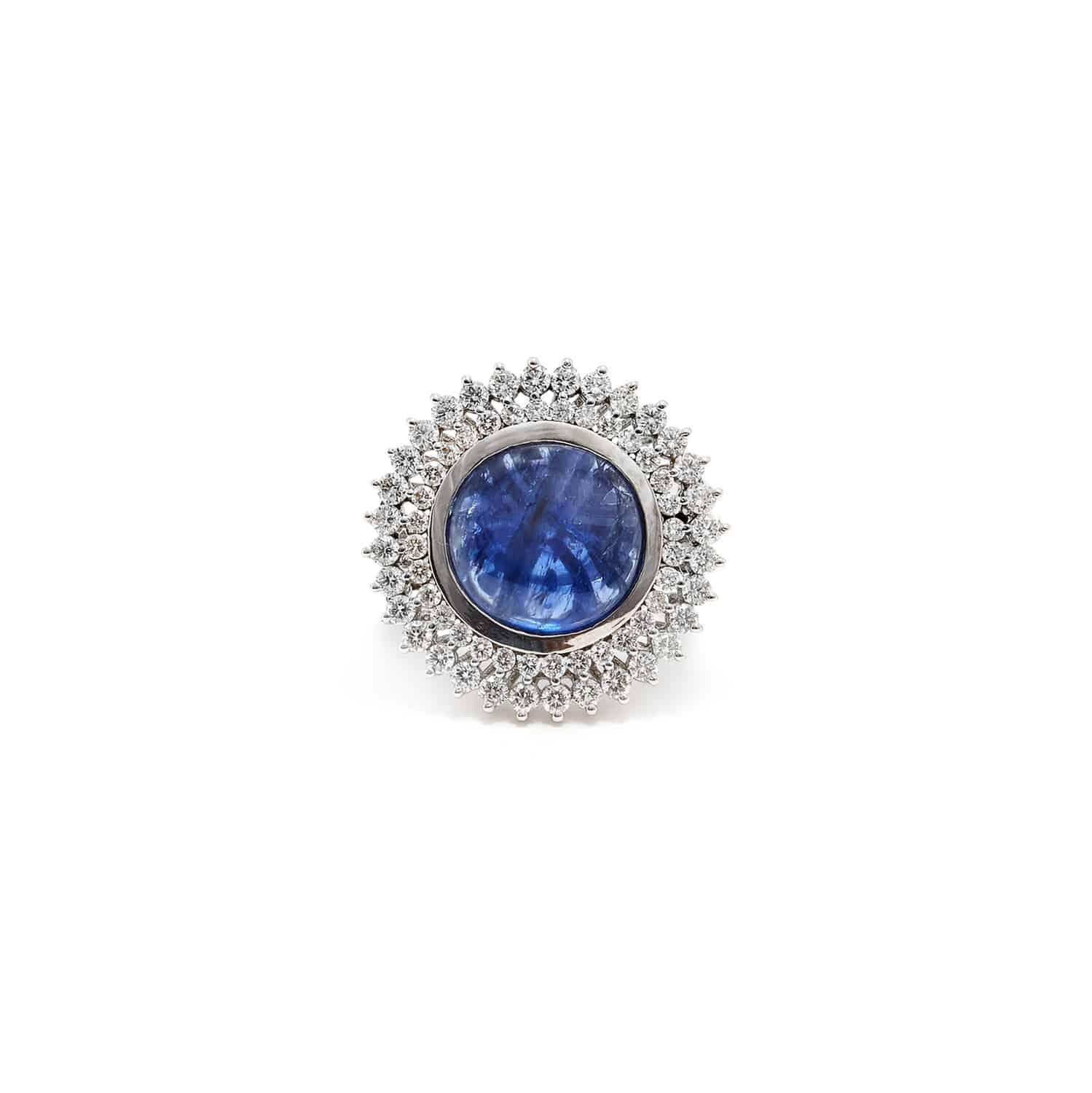 The Star Fall Sapphire... Reminiscent of a beautiful star shining alone in a stark clear sky… a fiery Burmese Blue Sapphire in with a star halo of Brilliant Cut White Diamonds set in  18K White Gold.


- Natural, Unheated Certified Burmese Sapphire