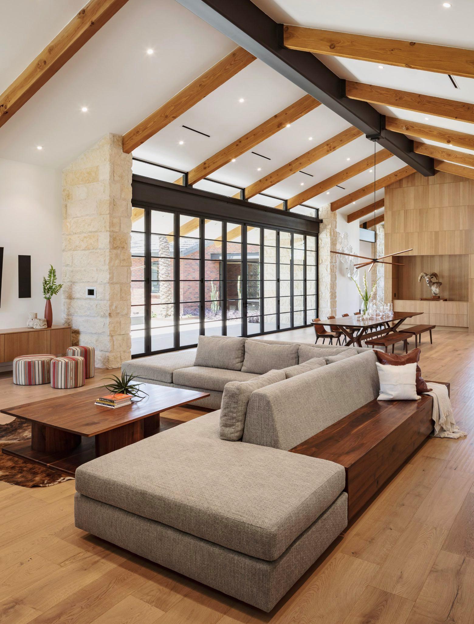 The Stewart Sectional by XAWD is a large, customizable sectional that offers 360-degree functionality with its elegant wooden backside. Ideal for open living rooms and large spaces, this sectional features hidden storage within the bench for added