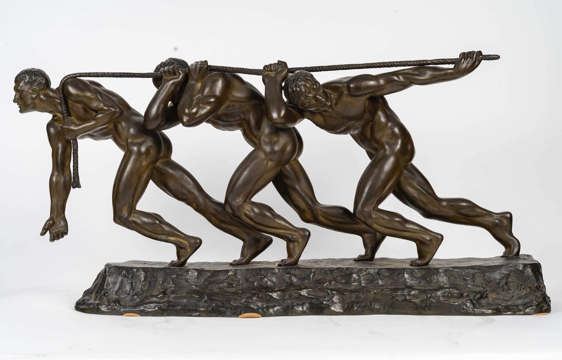 La Fuerza 
Grupo Art Déco de bronce patinado de Maurice Guiraud-Rivière (1881-1947)
Representa a tres hombres en pleno esfuerzo tirando de una cuerda, apoyados sobre una base naturalista oblonga
Firmado Guiraud.Riviere
hacia 1930

Nacido en 1881,