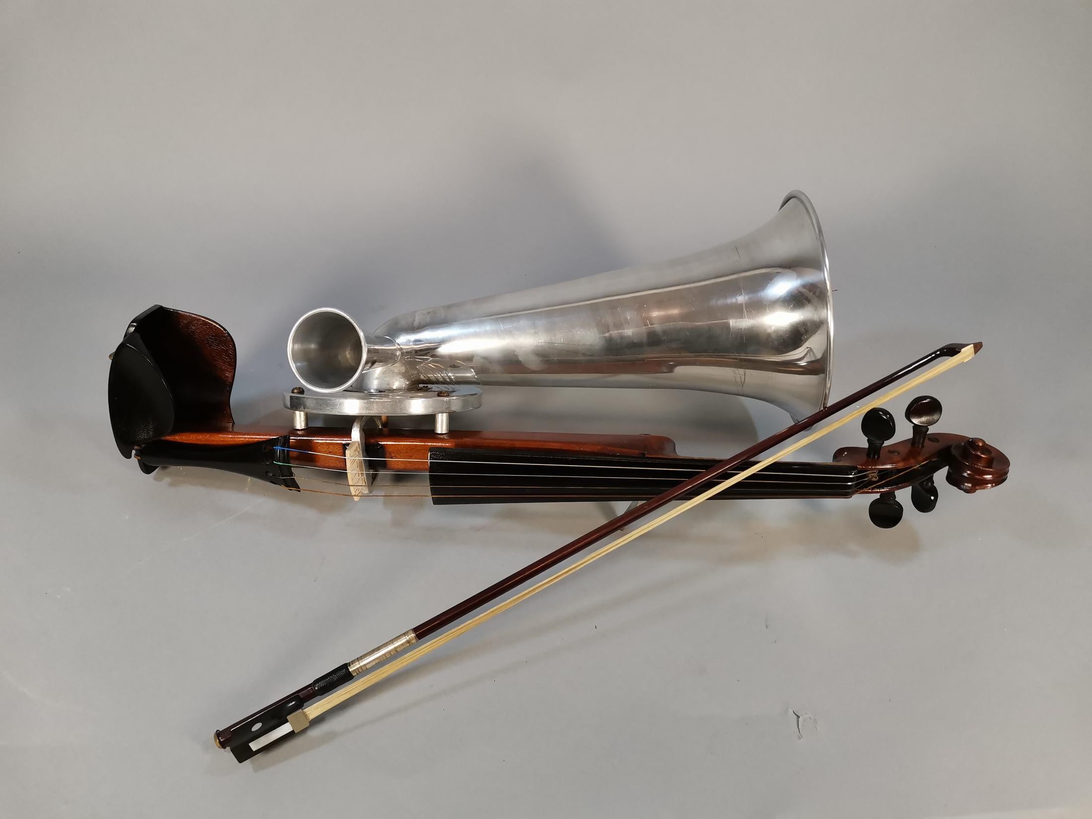 The Stroh or Stroviol violin is a type of stringed musical instrument that is mechanically amplified by a metallic resonator and a horn attached to its body. The name Stroviol refers to a violin, but other instruments have been modified with the