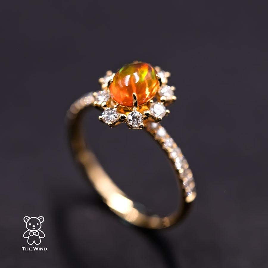 The Stunning - Mexican Fire Opal Engagement Halo Diamond Ring 18K Yellow Gold Promise Ring.

Design name: The Stunning!

Design idea: supreme quality of fire opal surrounded by 24 vs quality diamonds, which is simply stunning, elegant