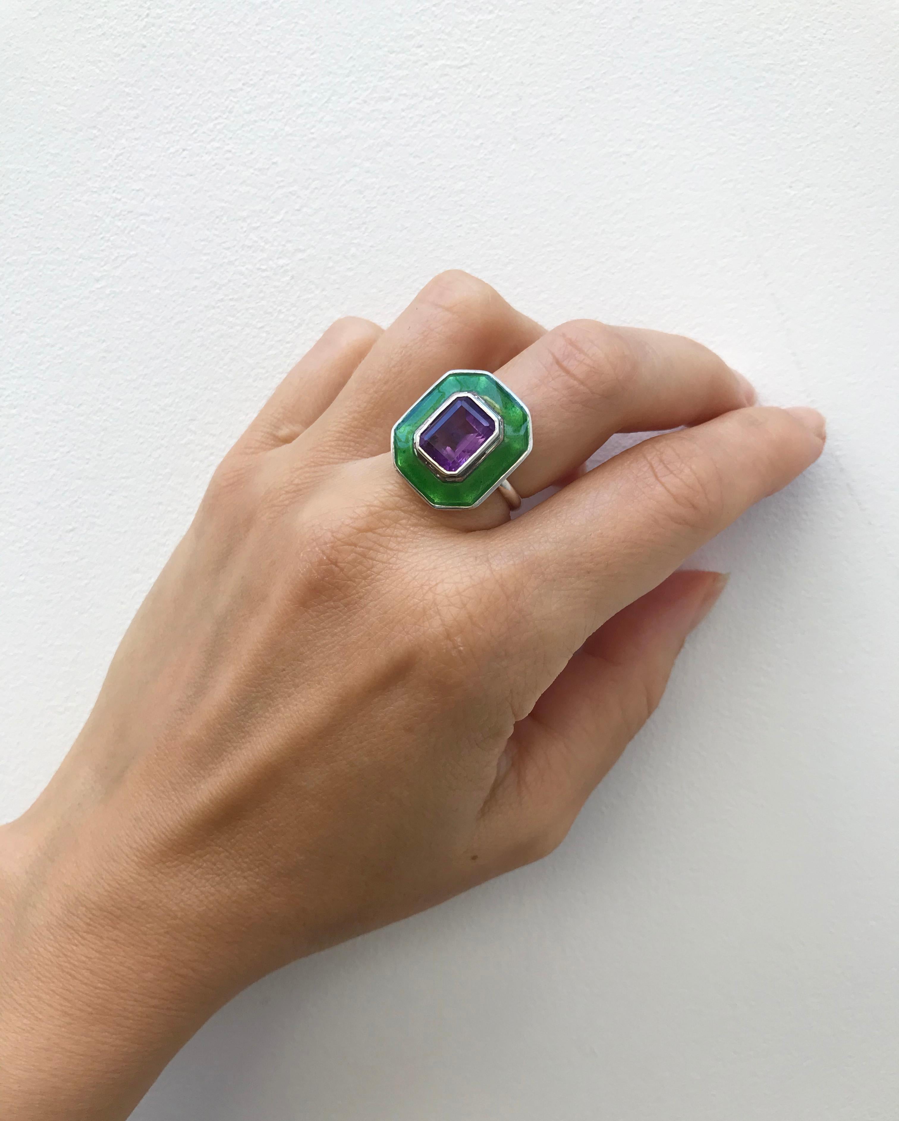 Rooted in clean, classic lines, this a bold yet elegant cocktail ring reflects the individuality of the wearer. Inspired by the Suffragettes we used white gold, amethyst and green dew vitreous enamel to celebrate the movement. This Art Deco inspired