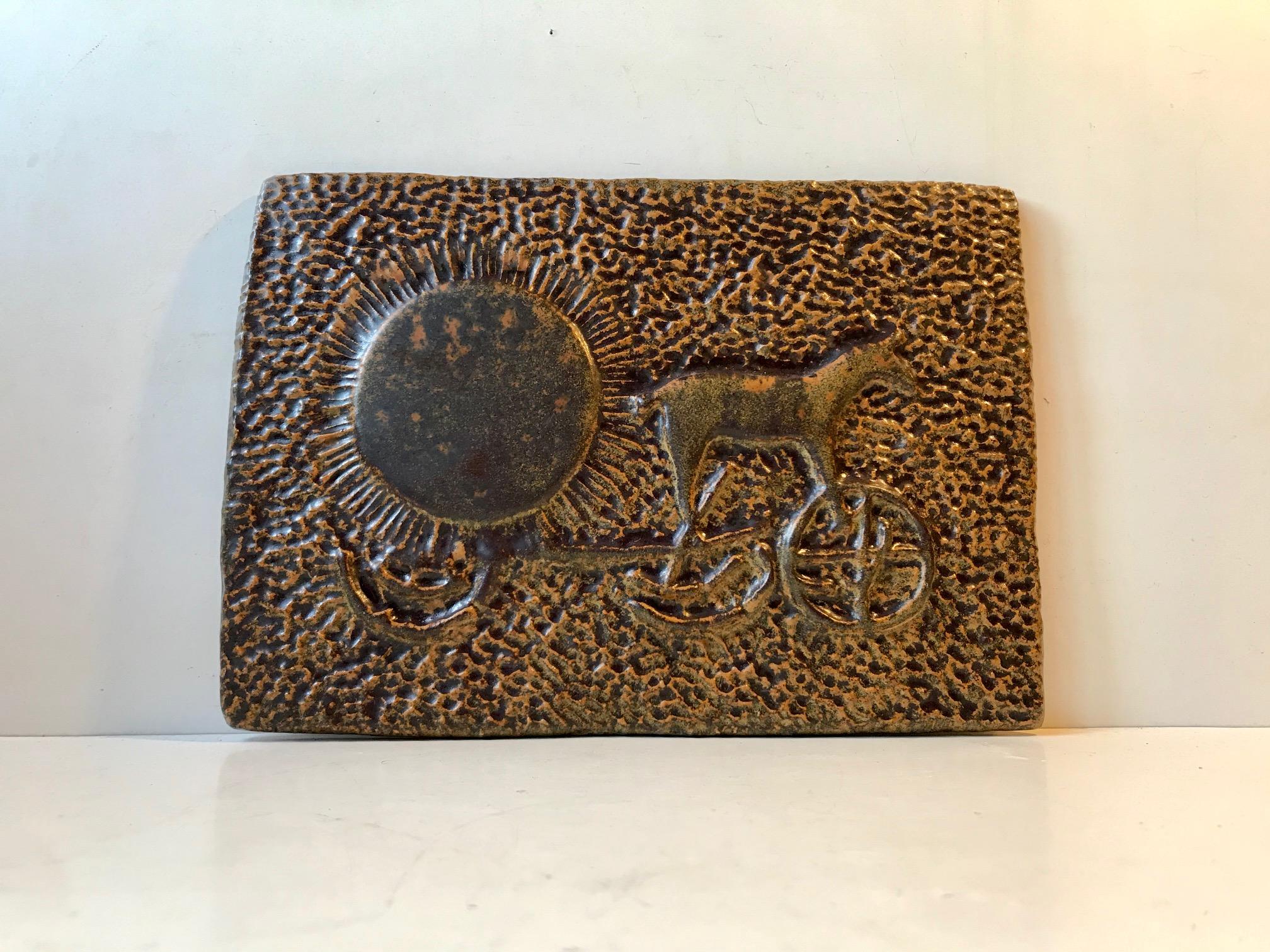 A depiction of The Bronze Age “Sun Chariot” – a very important Danish cultural icon, held in the National Museum of Denmark and even printed to the front side of the most valuable money note we have in Denmark. The Sun Chariot was found in Trundholm