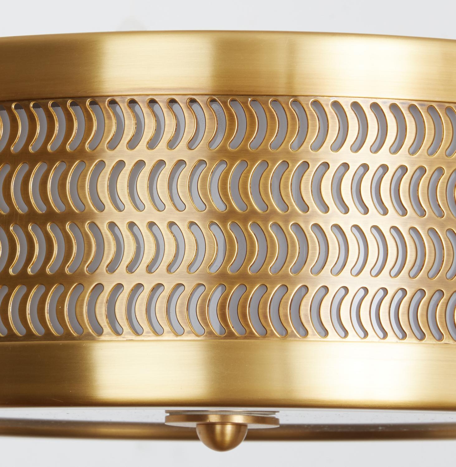 A new, contemporary David Duncan design. A brass flush mount with comma-shaped cutouts emitting light through an opal plexi diffuser on the sides. The frame divided into three sections, with over-scaled, oval cast brass rosettes. The underside with