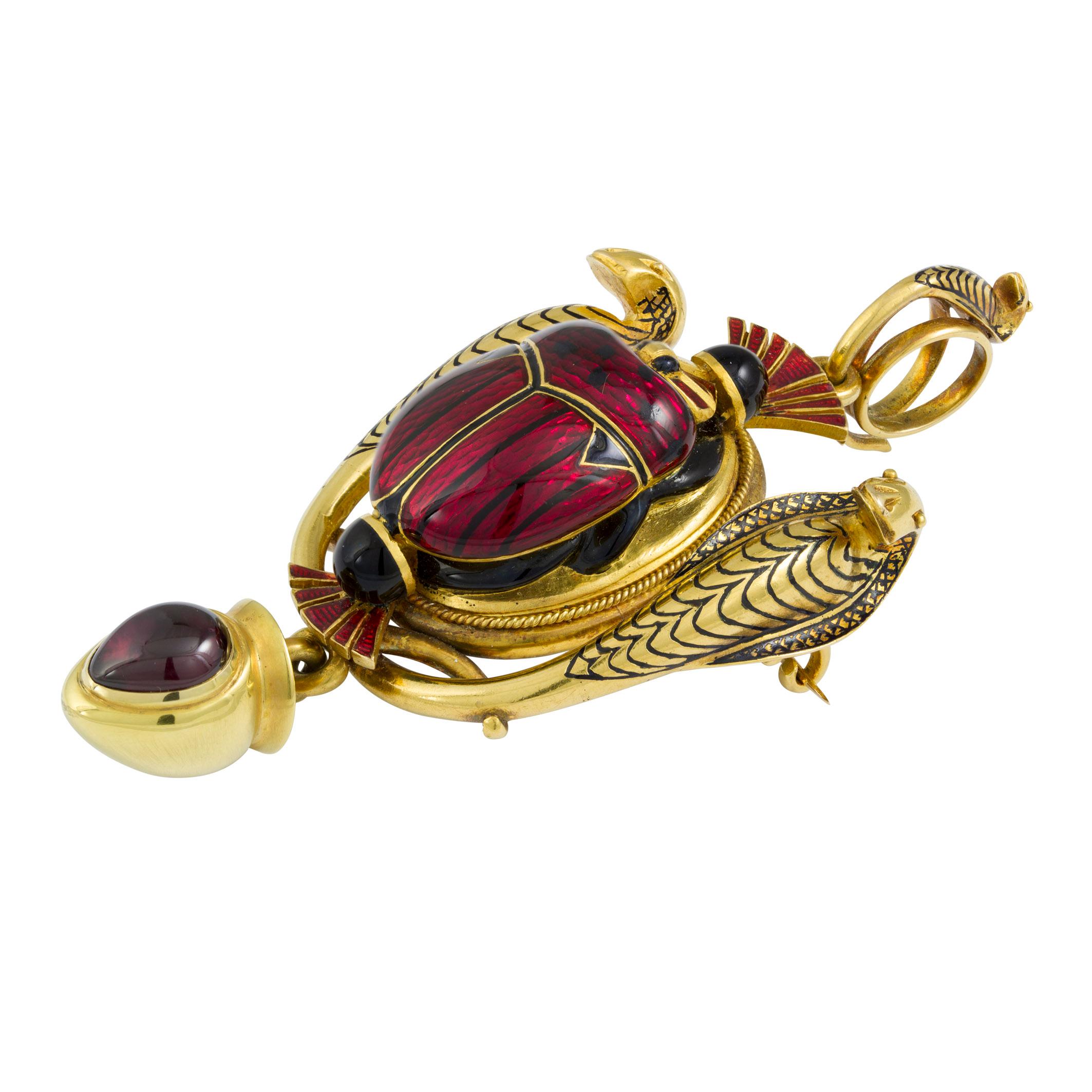 The Thebes Scarab Pendant: an archaeological revival gold and enamel scarab brooch/pendant, by Robert Phillips, set to the centre with a raised scarab rendered in deep red guilloché enamel with black enamel detail, between a pair of finely modelled