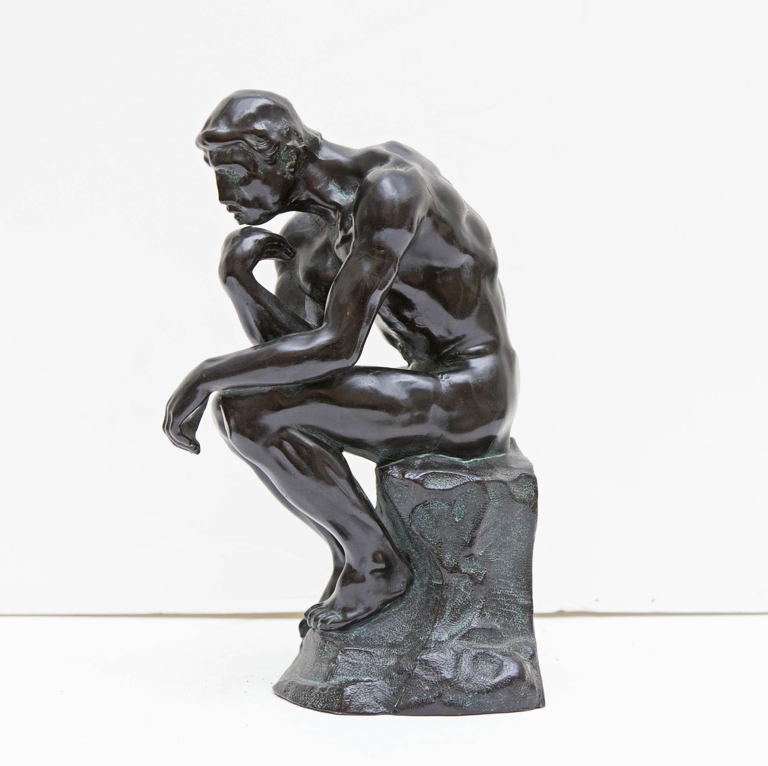 Patinated metal sculpture of the thinker after Auguste Rodin, early 20th century.