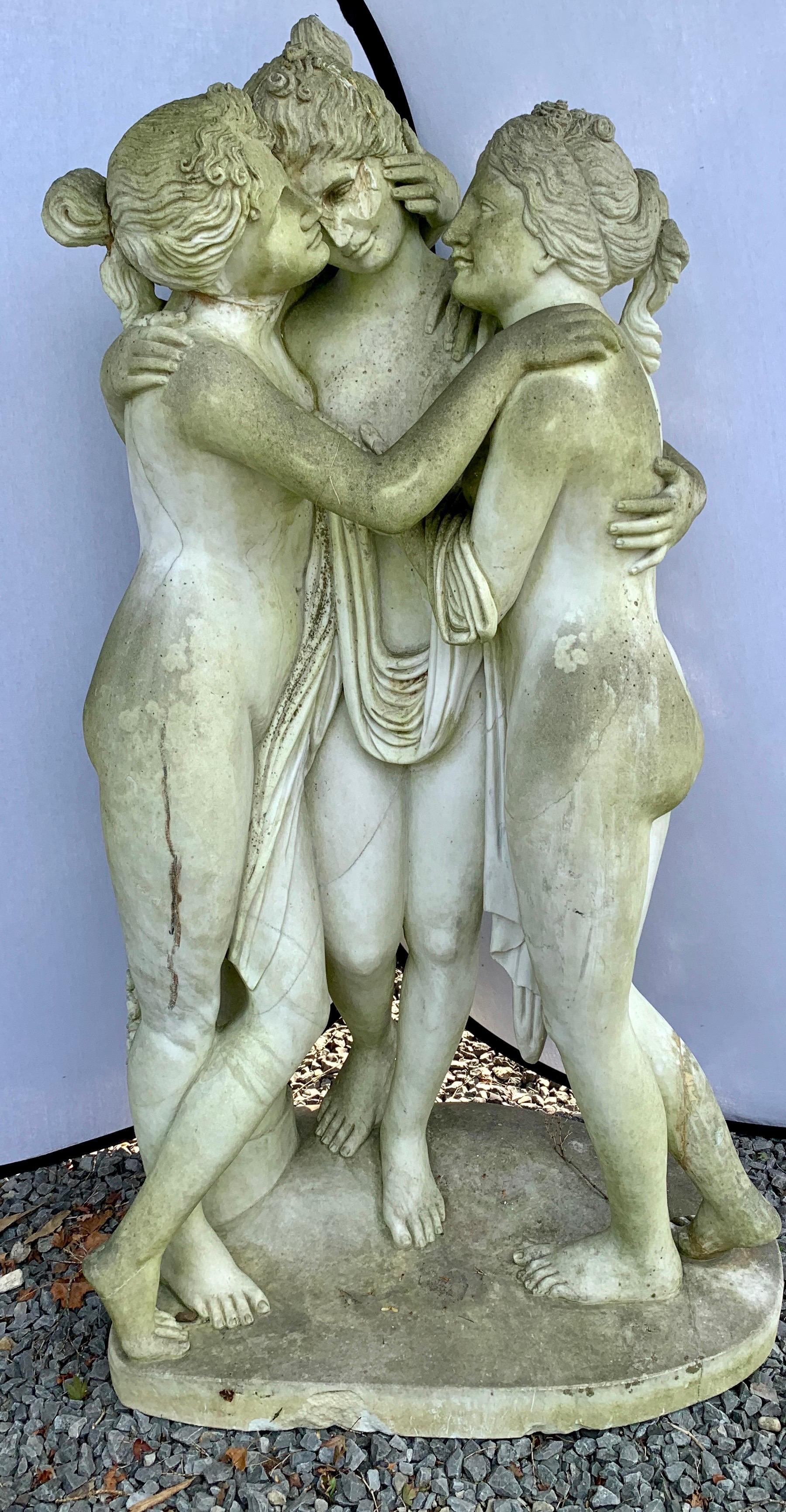 Life size marble statue depicting the Three Graces. According to Greek mythology, they were nymphs and goddesses that were the daughters of Zeus and the sea nymph Eurynome. Their names were Aglaia, Thalia, and Euphrosyne, and they were the