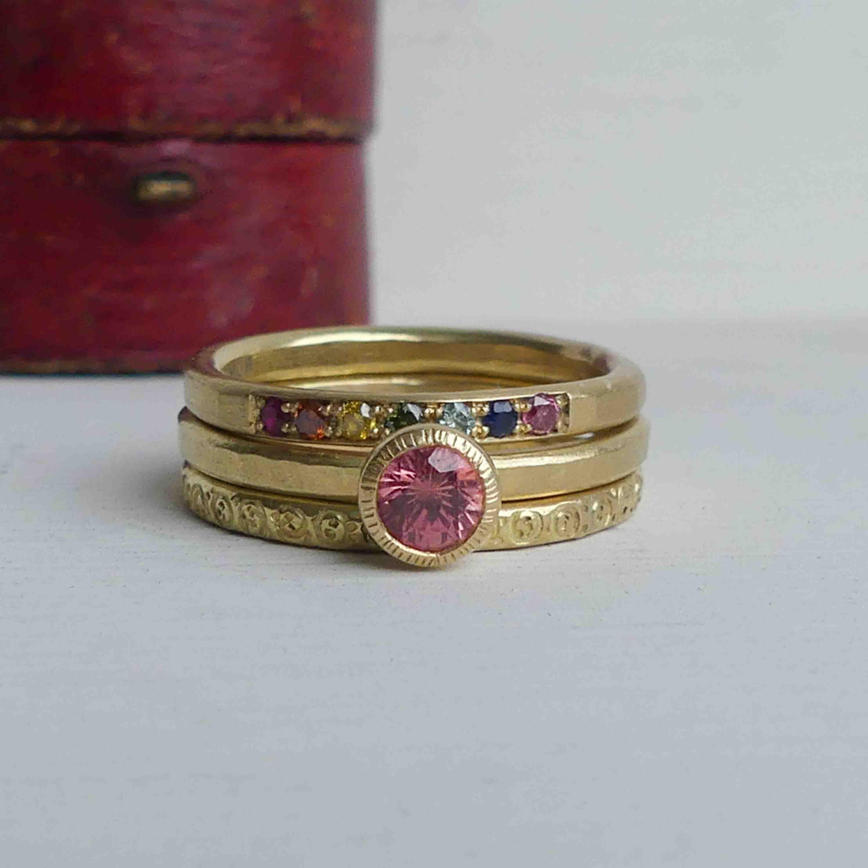 The Tigerlily padparadsha ethical ring is handmade with 18ct Fairmined gold and an ethically sourced padparadsha sapphire from Malawi.

Padparadsha sapphires have a rare beauty with their hues of pink and orange.  They are, among the rarest