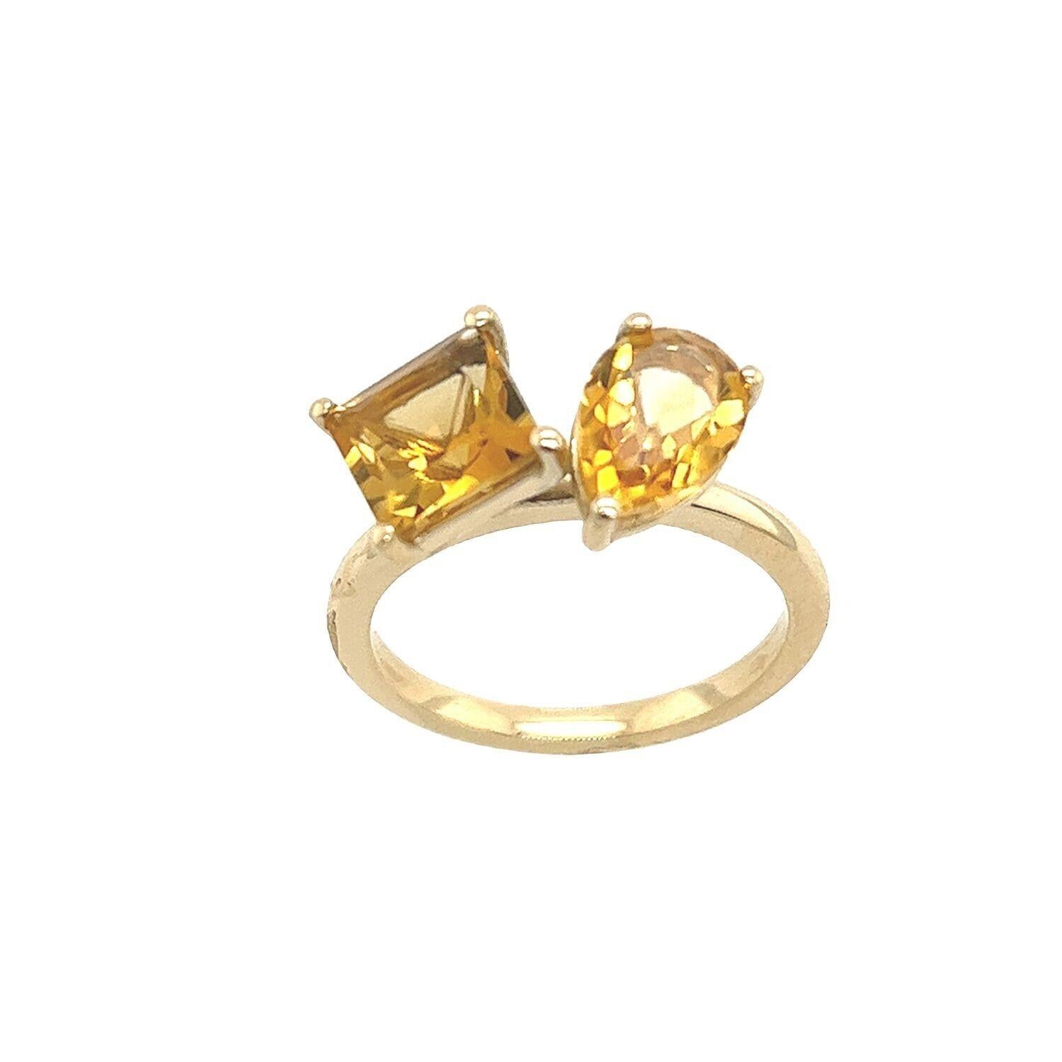 The Toi et Moi 2-stone Citrine cocktail ring Set in 14ct Yellow Gold setting, with a square shape and a pear shape Citrine, 2.74ct total Citrine weight. This ring is elegant and beautiful.

Additional Information:
Total Citrine Weight: 2.74ct
Width