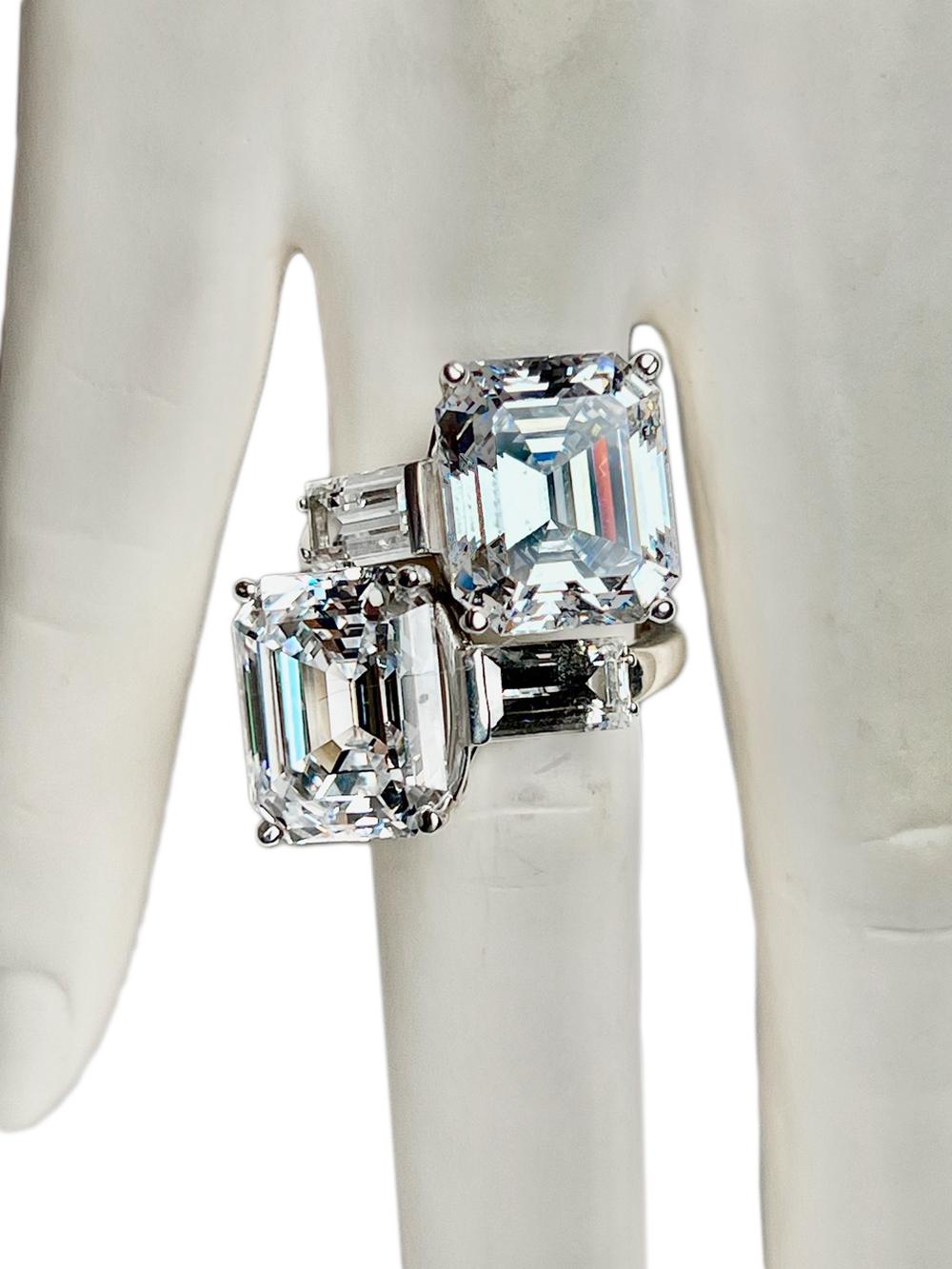 The Toi et Moi Love Ring In Costume Jewelry 15 Carat Each Asscher Cut Diamonds

Two stunning Lab Grown D Grade Diamond Cut Cubic Zirconia  , cut in the Asscher cut style and set with baguettes, crossover like two Lovers entwined. Brilliant D-colour