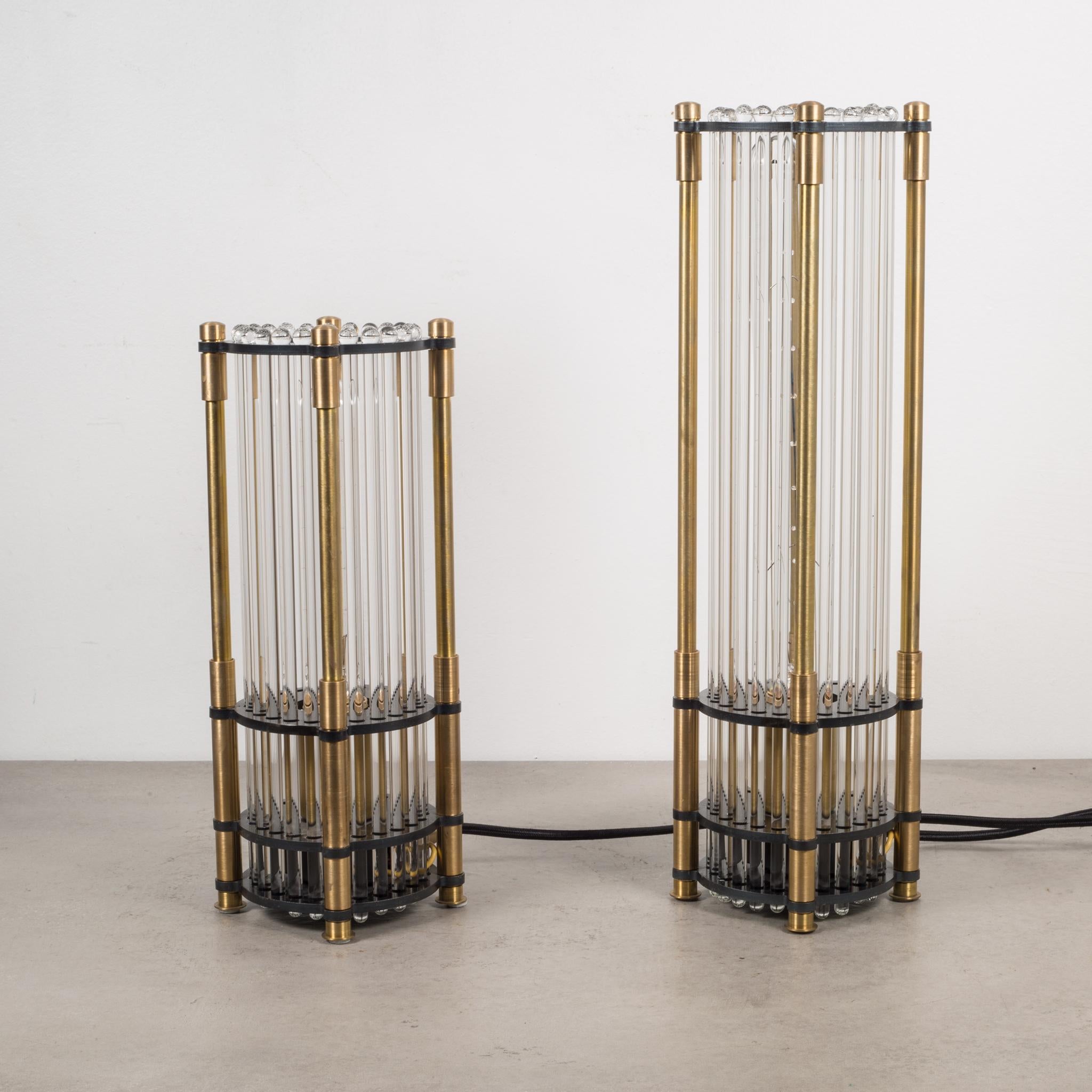 About:

Solid brass touch sensitive table lamps with glass rods and black accents. Three settings of warm light at your fingertips.

The medium light has sold. The large one is available. 

(Retailed for $885 and $775)

Creator: Jay Jeffers for
