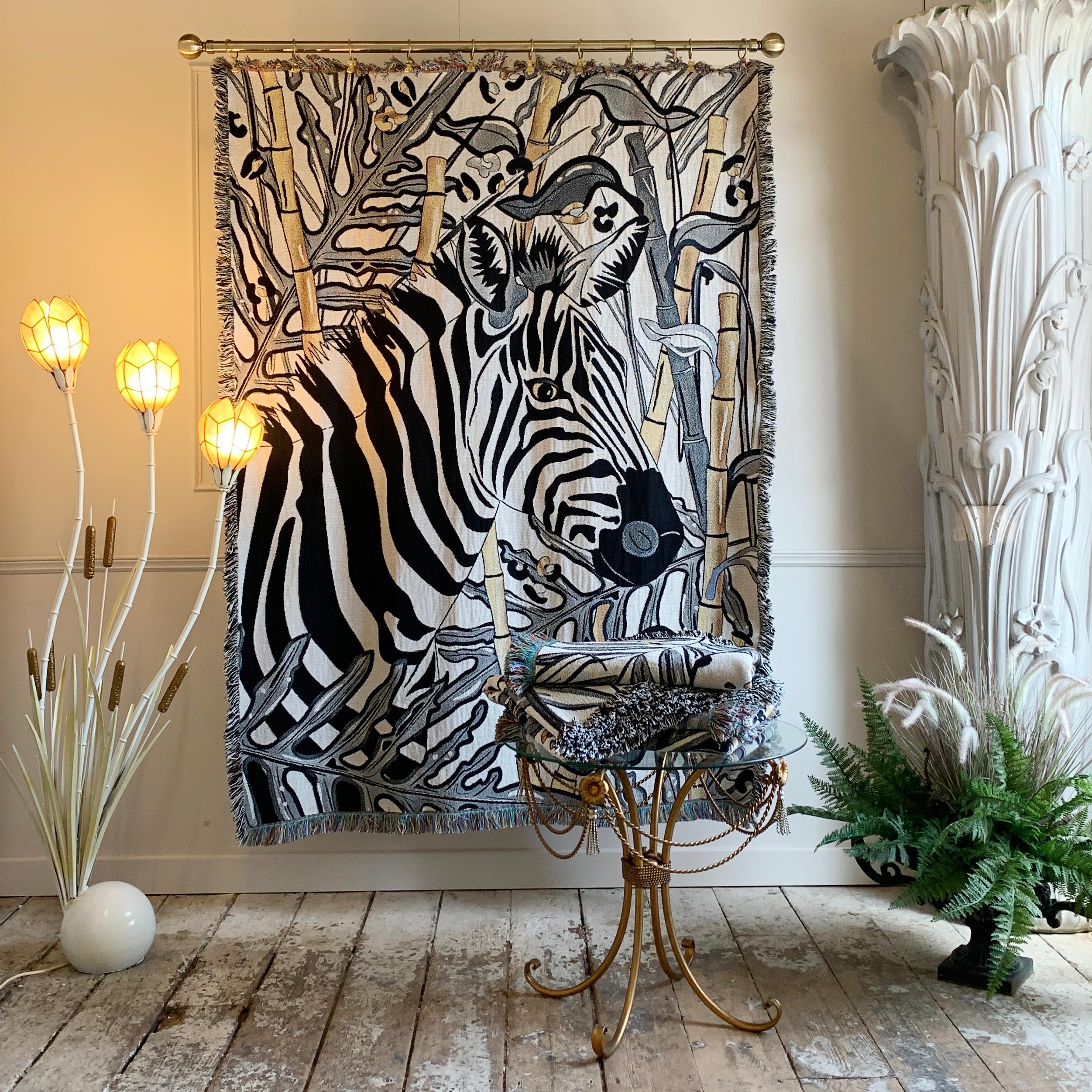 The Tropics Collection 'Zebra' woven recycled cotton throw 

As a throw, blanket, draped or a wall hung, this luxuriously versatile woven throw will create a bold statement in any interior.

Beautifully dramatic monochrome throw, adorned with a