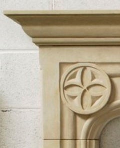 The Tudor: A Classic Tudor-Style Stone Fireplace with Quatrefoil Medallions