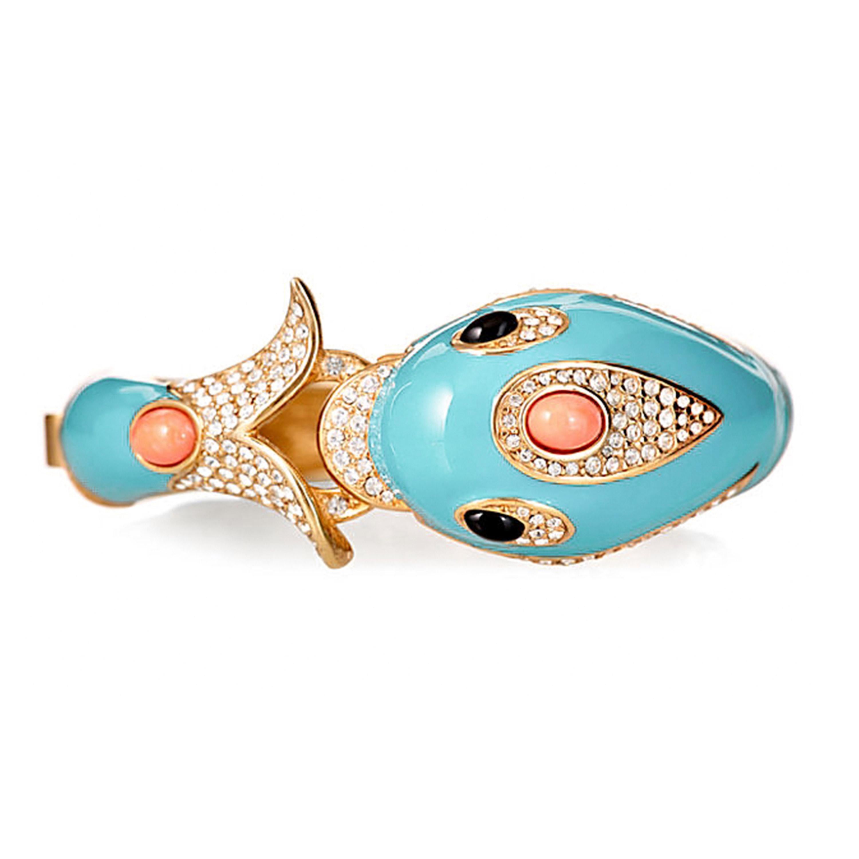 The Turquoise Dolphin bracelet was introduced to CINER’s line in the early 1980’s and was one of the many CINER pieces Elizabeth Taylor collected. A sweet and chic piece, The Dolphin Bracelet is a favorite among many CINER admirers and collectors.