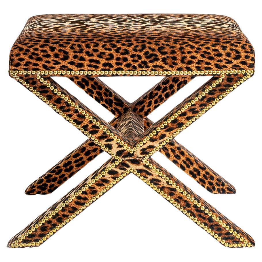 The upholstered Alexander X-Frame stool in Leopard Velvet with nailing detail For Sale