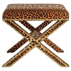 The upholstered Alexander X-Frame stool in Leopard Velvet with nailing detail