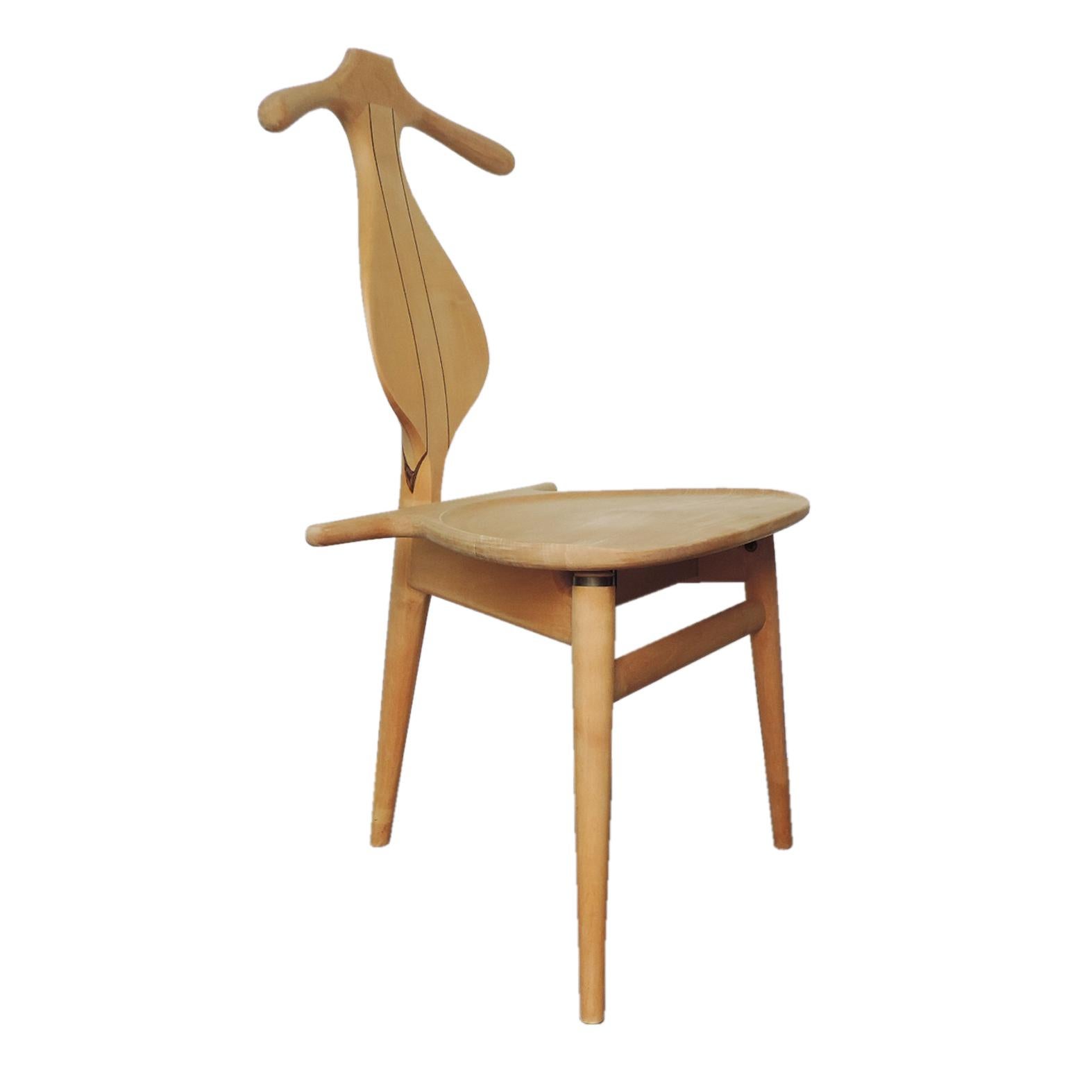 One of the most sculptural and iconic three-legged chairs ever designed by Hans J. Wegner. The Valet Chair is the ultimate functional chair to sit in your bedroom, bathroom or simply as a piece of art (like a cello) sitting quietly at the end of a