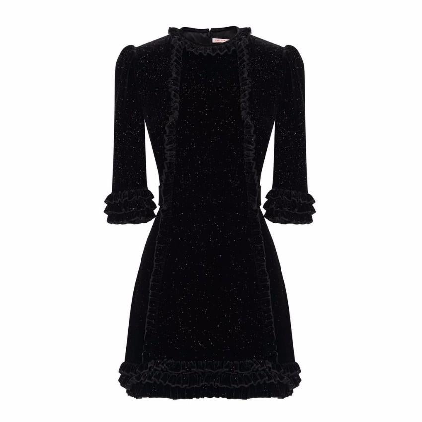 The Vampire's Wife Black Sparkle Velvet Mini Cate Dress

- Black Mini Cate Dress
- Velvet 
- Gold toned sparkle details throughout 
- Ruffle trim edges and details around neck 
- Tie-able waist bands 
- Zip fastening closure at back of dress