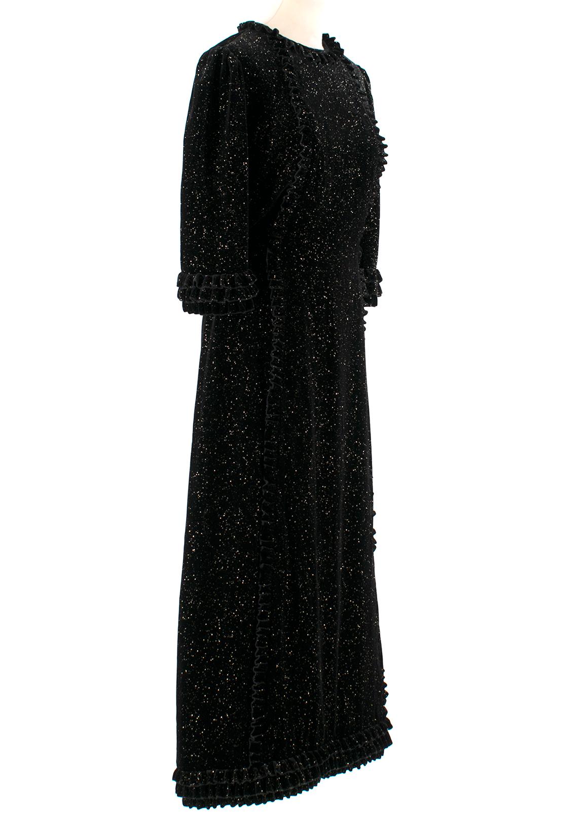 The Vampire's Wife Street Sweeper Sparkle Velvet Cate Dress

- Velvet with glittering detail
- Short sleeves
- Ruffles at the neck, end of sleeves, body length and bottom hem
- Strip at the waist
- Invisible zipper closing at the back 
- Full
