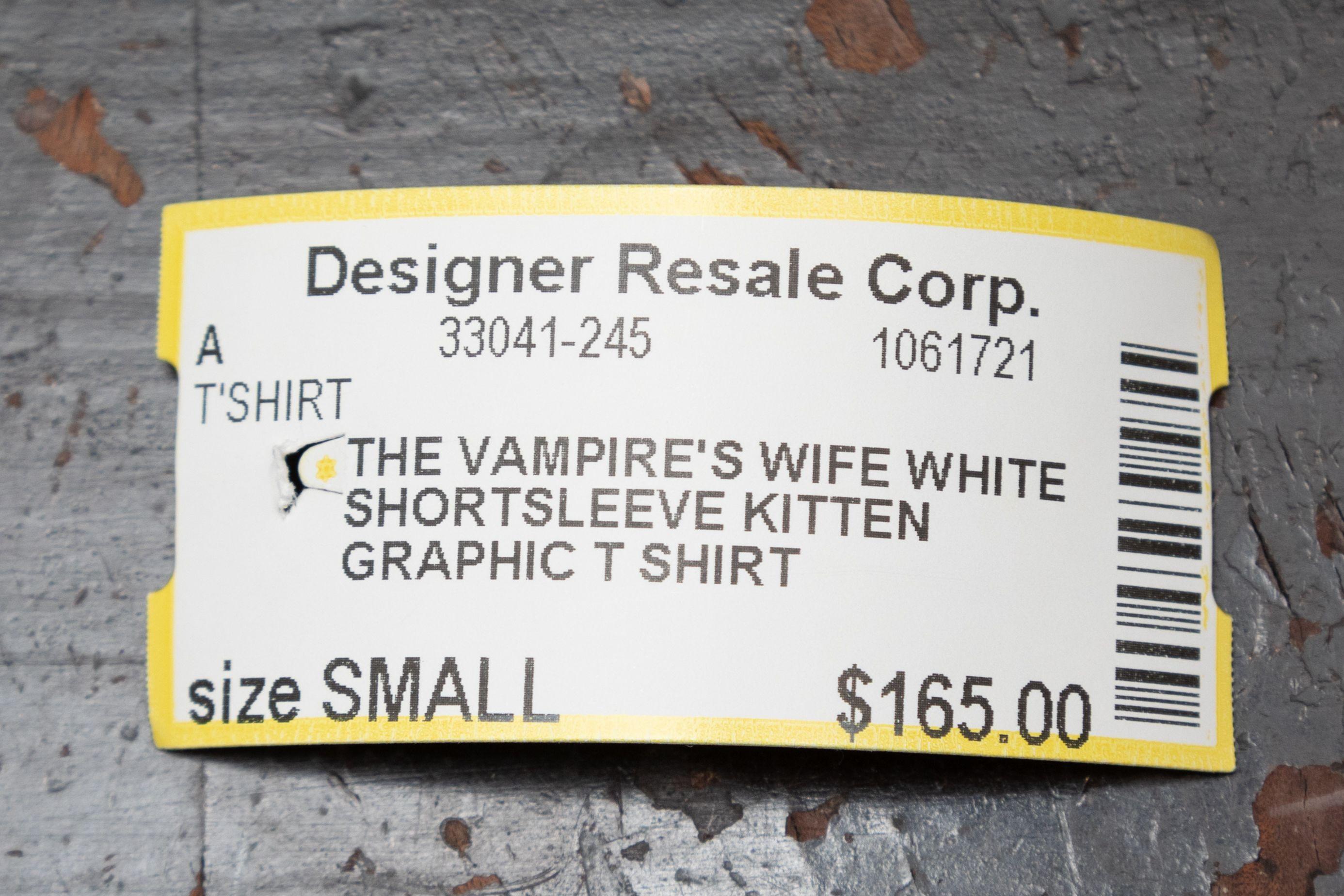 Product Details: White and multicolor kitten print graphic T-shirt by The Vampire's Wife. Crew neck. Short sleeves. 37