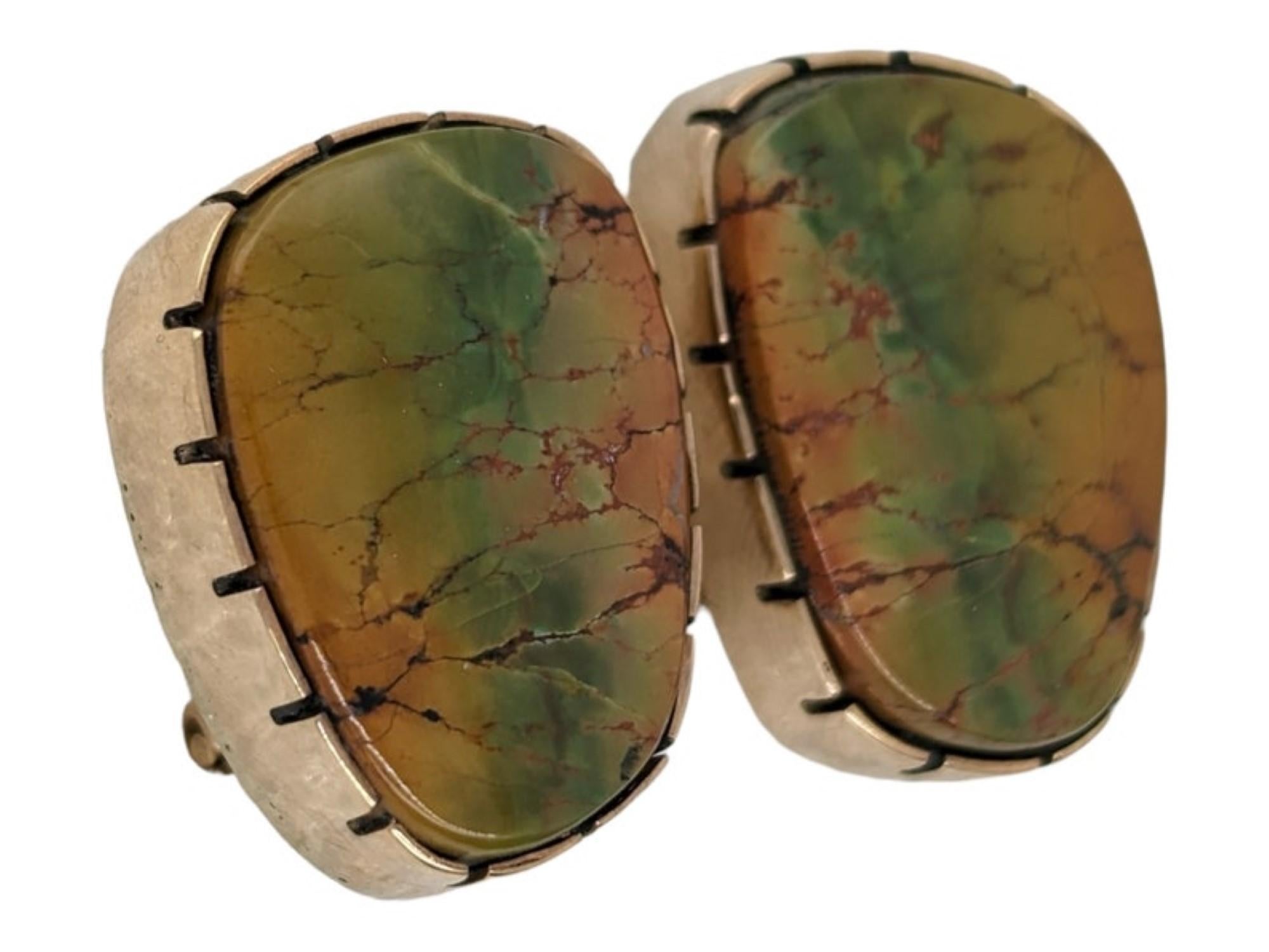 Discover our handcrafted earrings by silversmith Rob Sherman. These earrings feature cowboy and bohochic aesthetics. Perfect for those who appreciate a blend of traditional and modern styles! Each pair is uniquely mismatched, featuring green