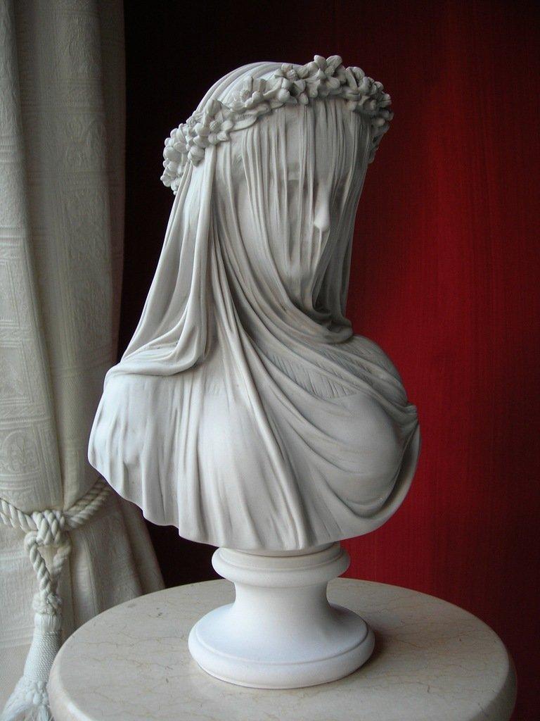 The Veiled Lady a bust, after the antique by Monti, 1875.
Also known as the bride, this sculpture was created by the Italian sculptor Raphaelle Monti, who came to live and work in England, 1850. He established his name with the Veiled Lady