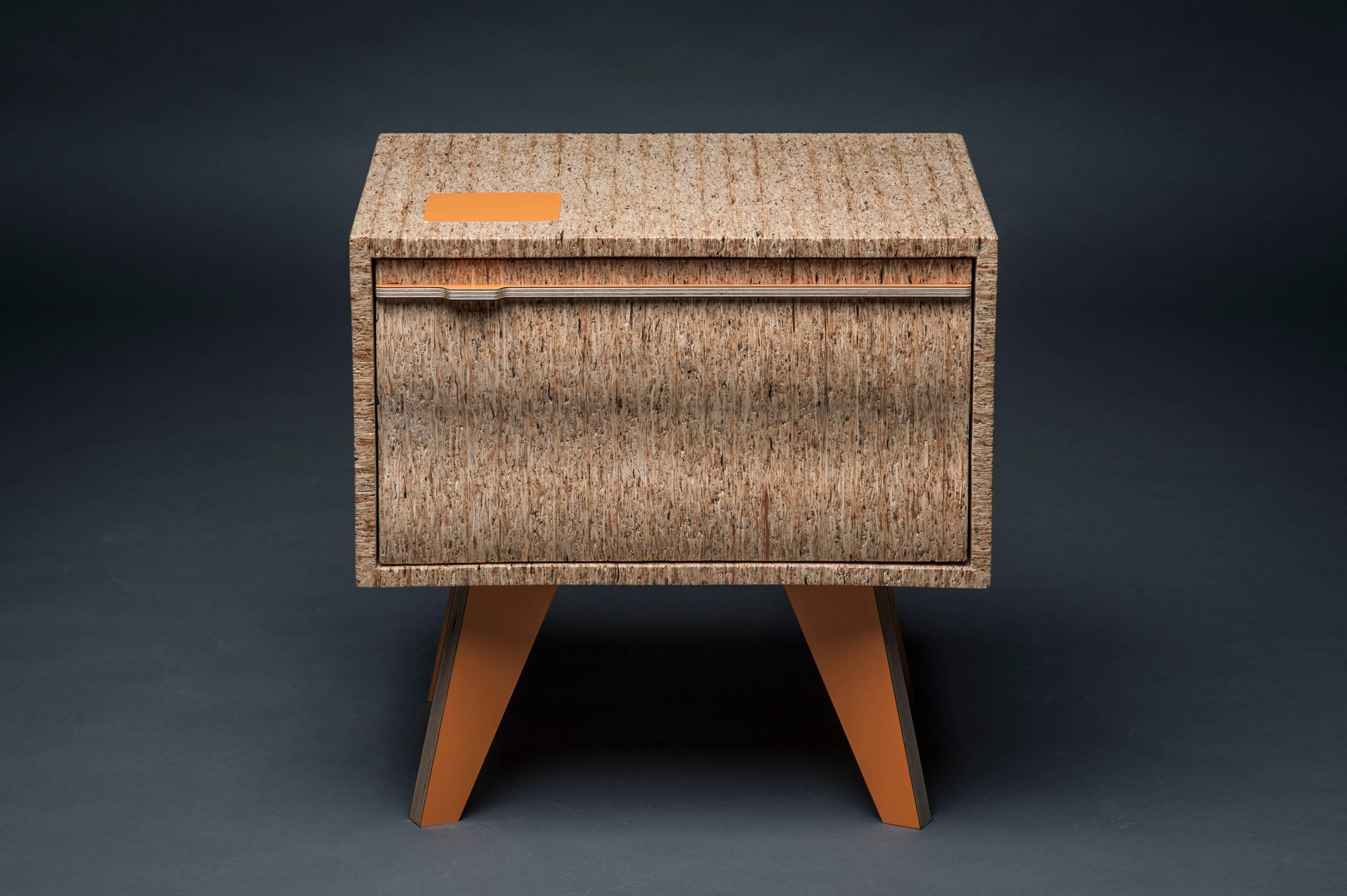 The Vernon nightstand is made using the end grain from OSB board giving it a unique look and feel. It features veneered plywood legs and handle detail.