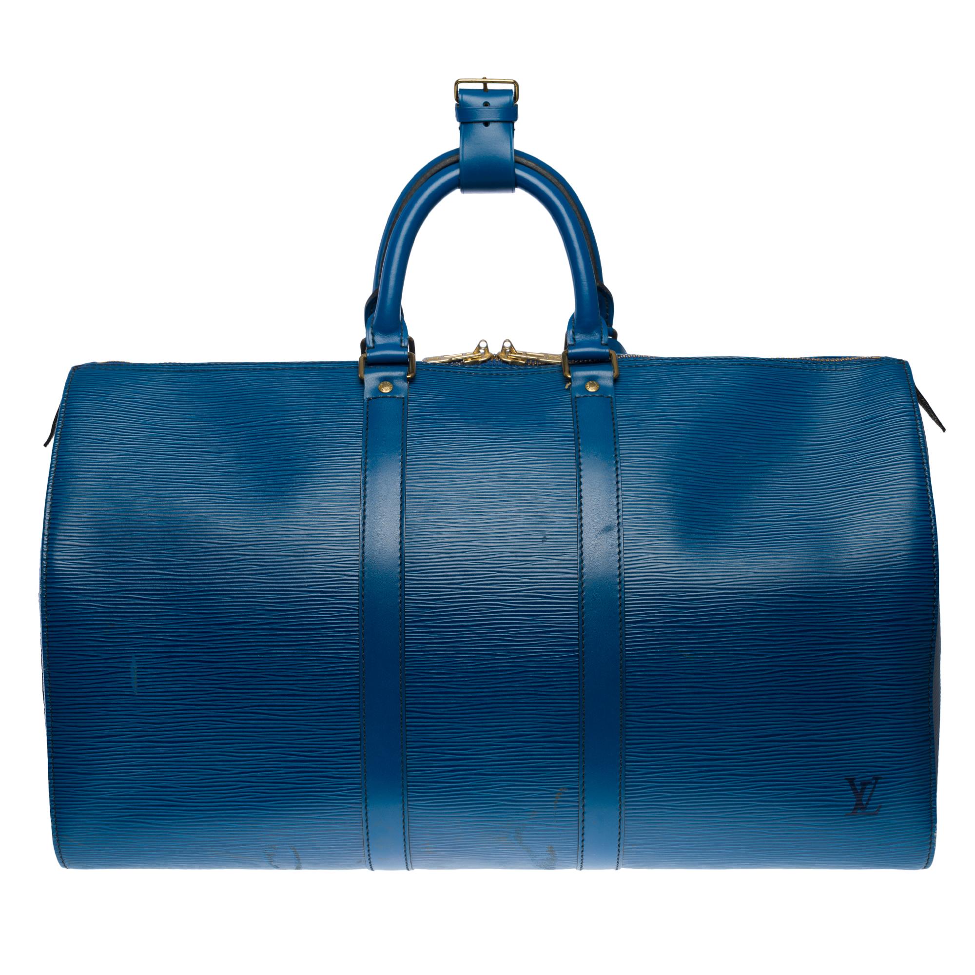 The very Chic Louis Vuitton Keepall 45 Travel Bag in Cobalt Blue Epi Leather, Double Slider Zipper, Double Blue Leather Handle
Zip
A side patch pocket
Inner lining in blue suede
Signature: 
