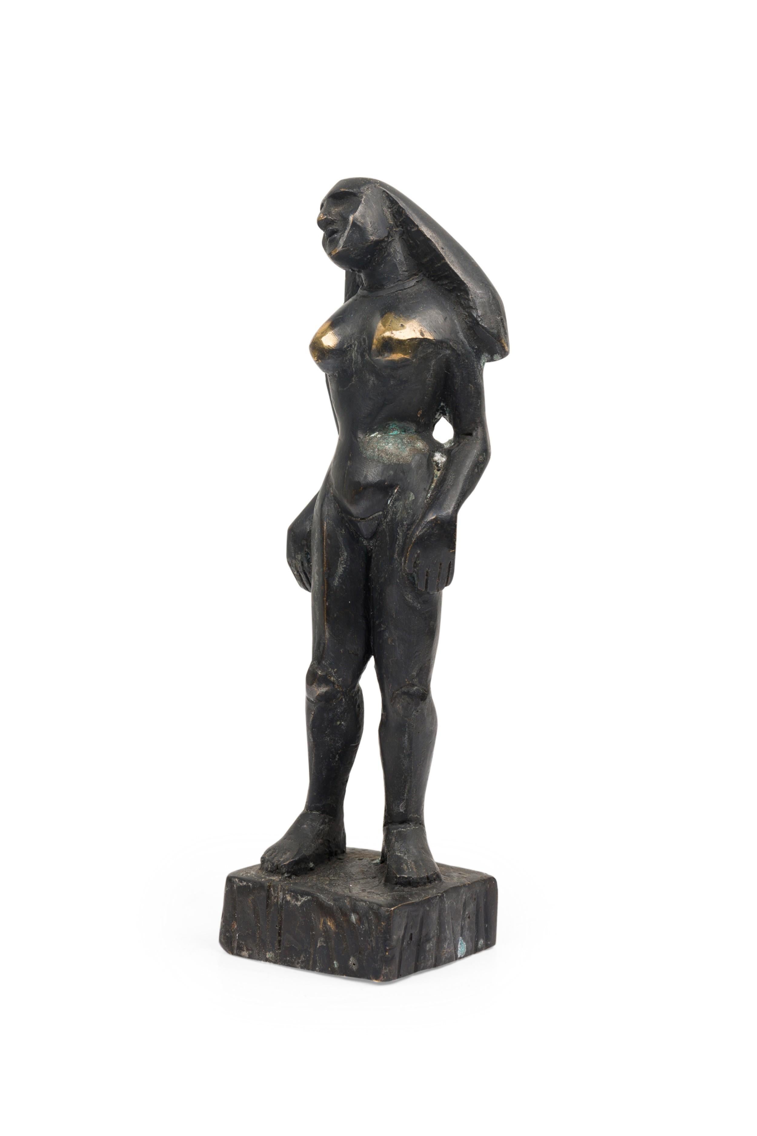 Contemporary hand-forged bronze Brutalist-inspired figural sculpture in an idle standing pose finished in an ebonized patina. (PRICED EACH) (
