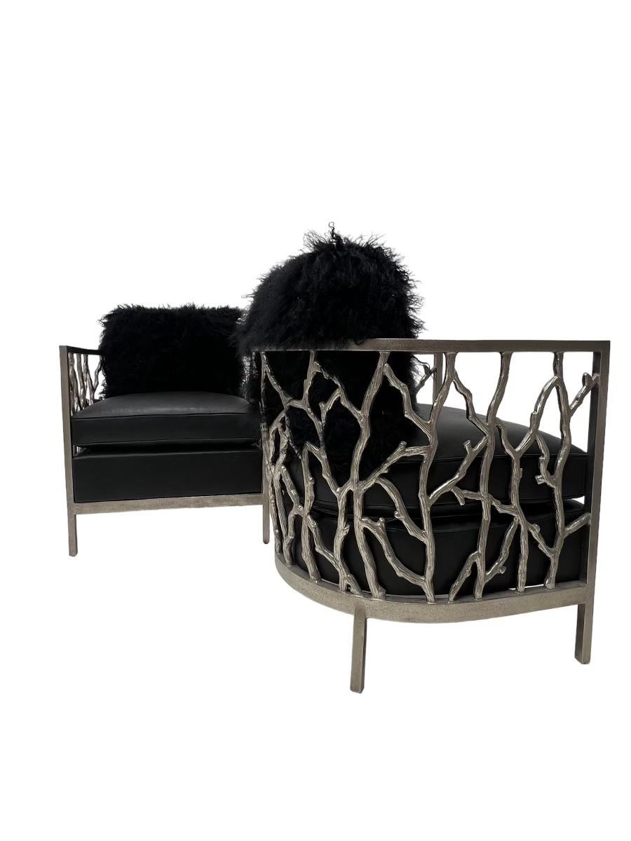 These triplet set of chairs sports a polished cast aluminum frame. The chair host a plush and plump distressed leather cushion with a combination foam/feather insert. The shaggy sheared black Mongolian sheepskin gives these chairs a mid century