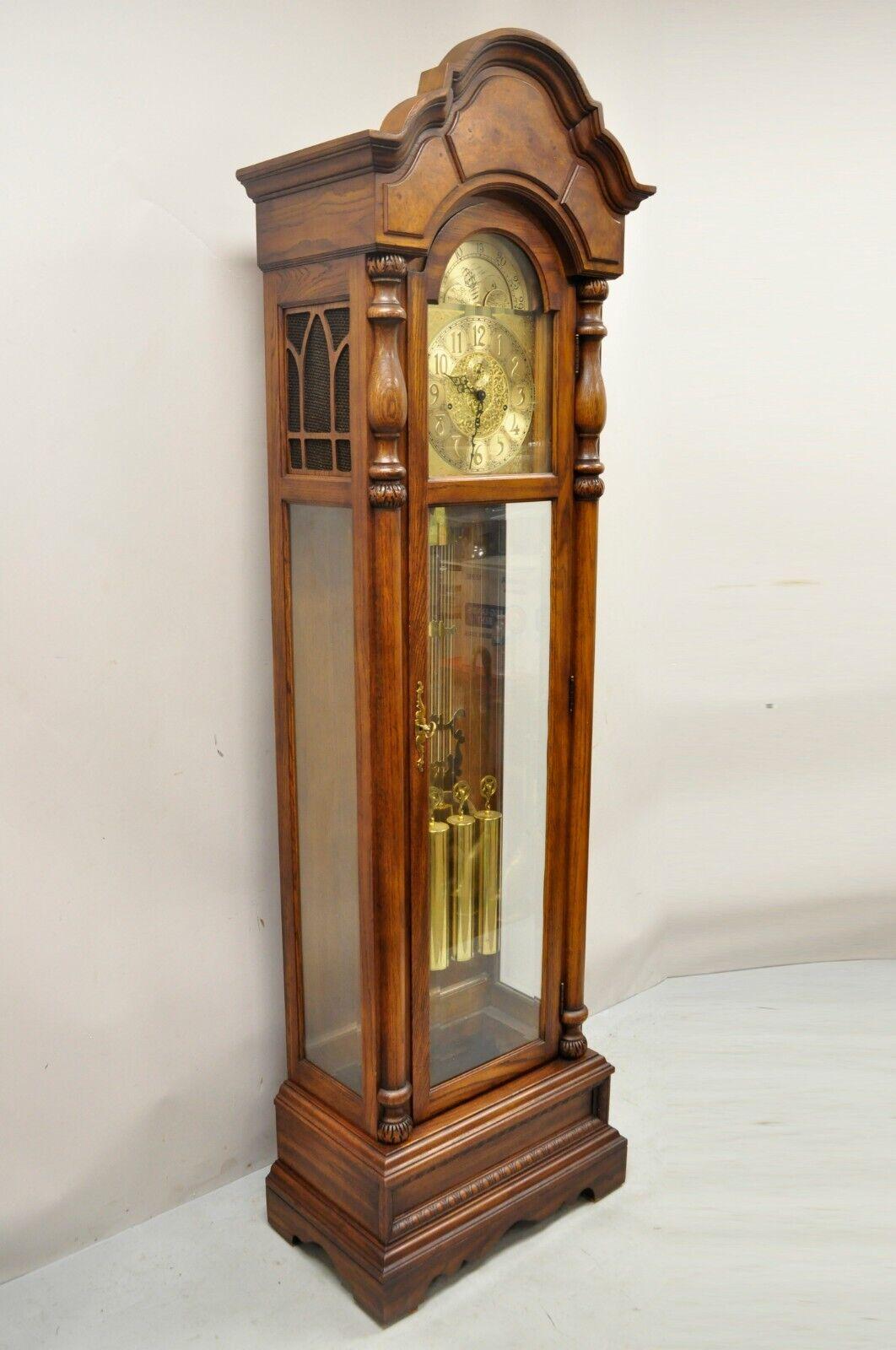 The Walden Ridge Ridgeway Grandfather Clock Oak Tall Case. Item features serial # 8206809, solid wood frame, beautiful wood grain, quality American craftsmanship, great style and form, brass plaque reads 