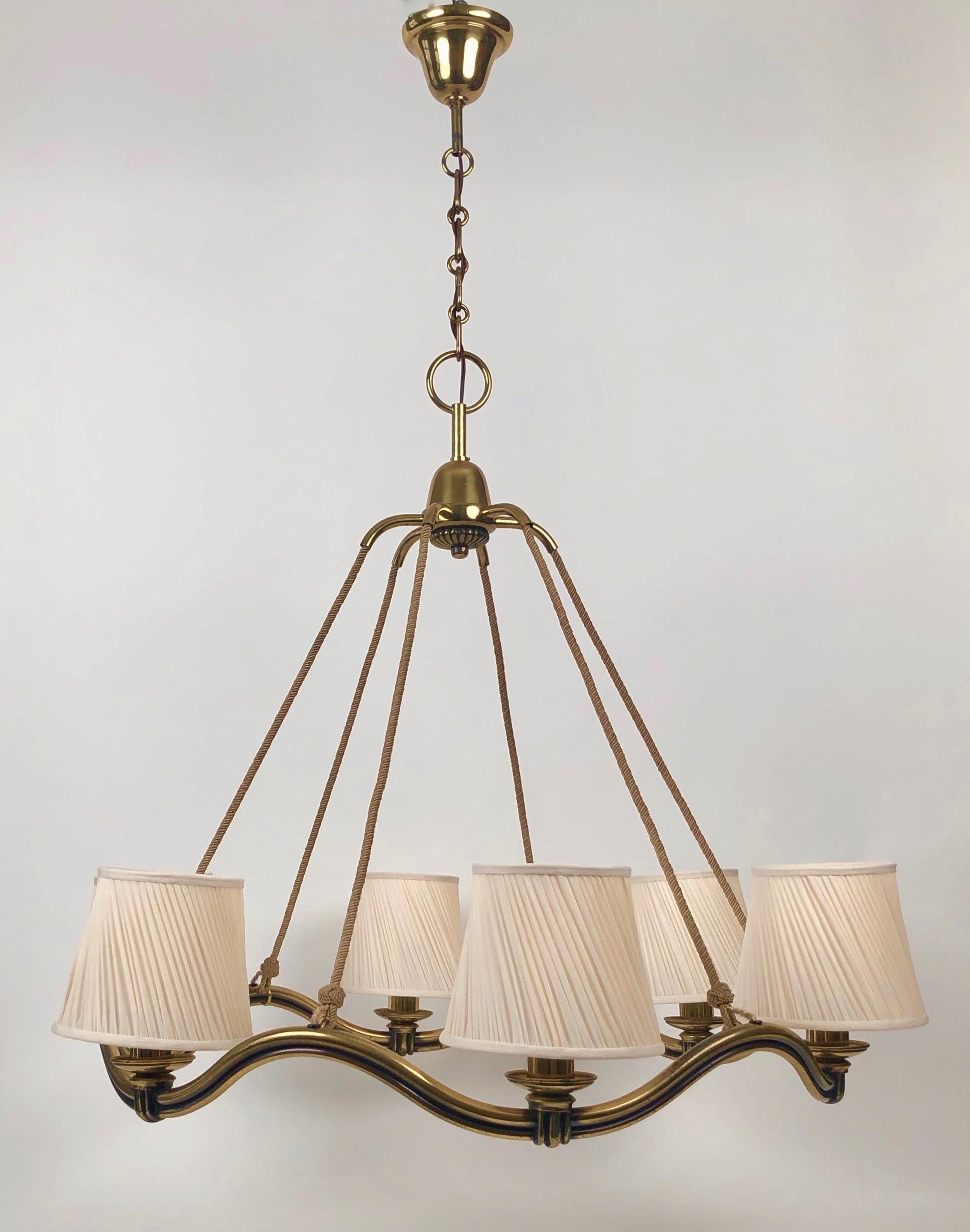Early modernist pendant lamp from Hugo Gorge . The Wave is a pressure cast brass lamp with 6 e-27 fixtures.
The quality and fit is very impressive. This version was produced from the early 1930's until the early 1950's in
limited numbers. The