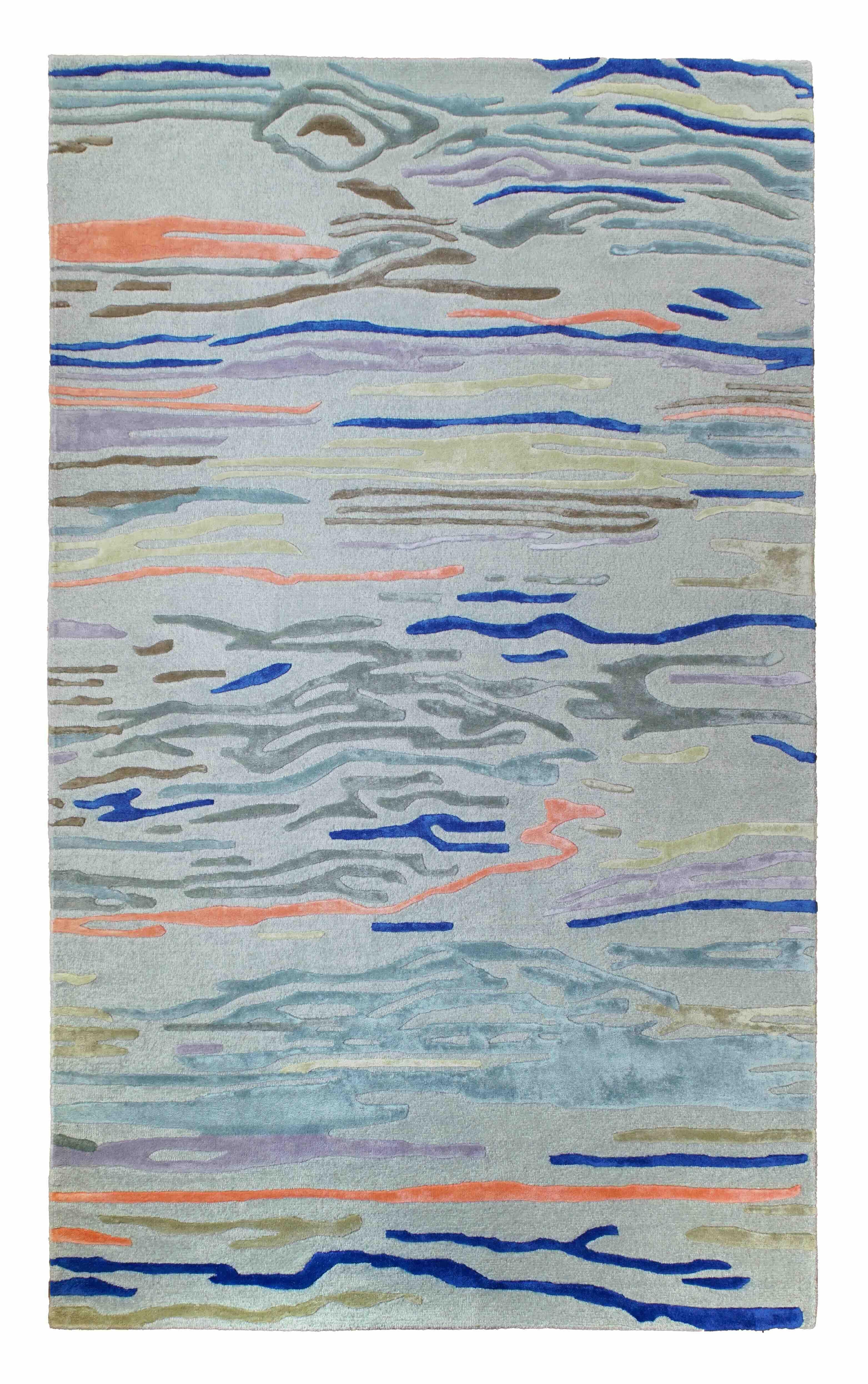 Our Waves Rug is inspired by the mesmerising hues of the ocean. This rug is hand-tufted from a blend of wool and silk, featuring a sophisticated cut and loop pile that adds both texture and depth. A perfect balance of beauty and craftsmanship, it