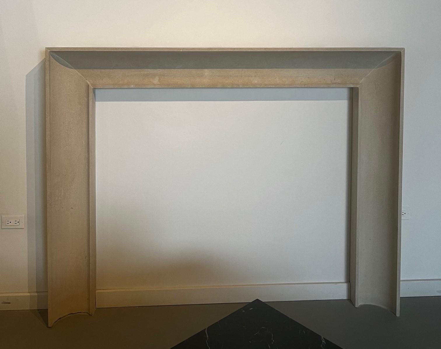 The Westchester stone fireplace features a simple but elegant concave profile, ending in a simple thin square frame around both the outer and inner edges. Its simplicity allows this design to blend perfectly into almost any decor and any room. This