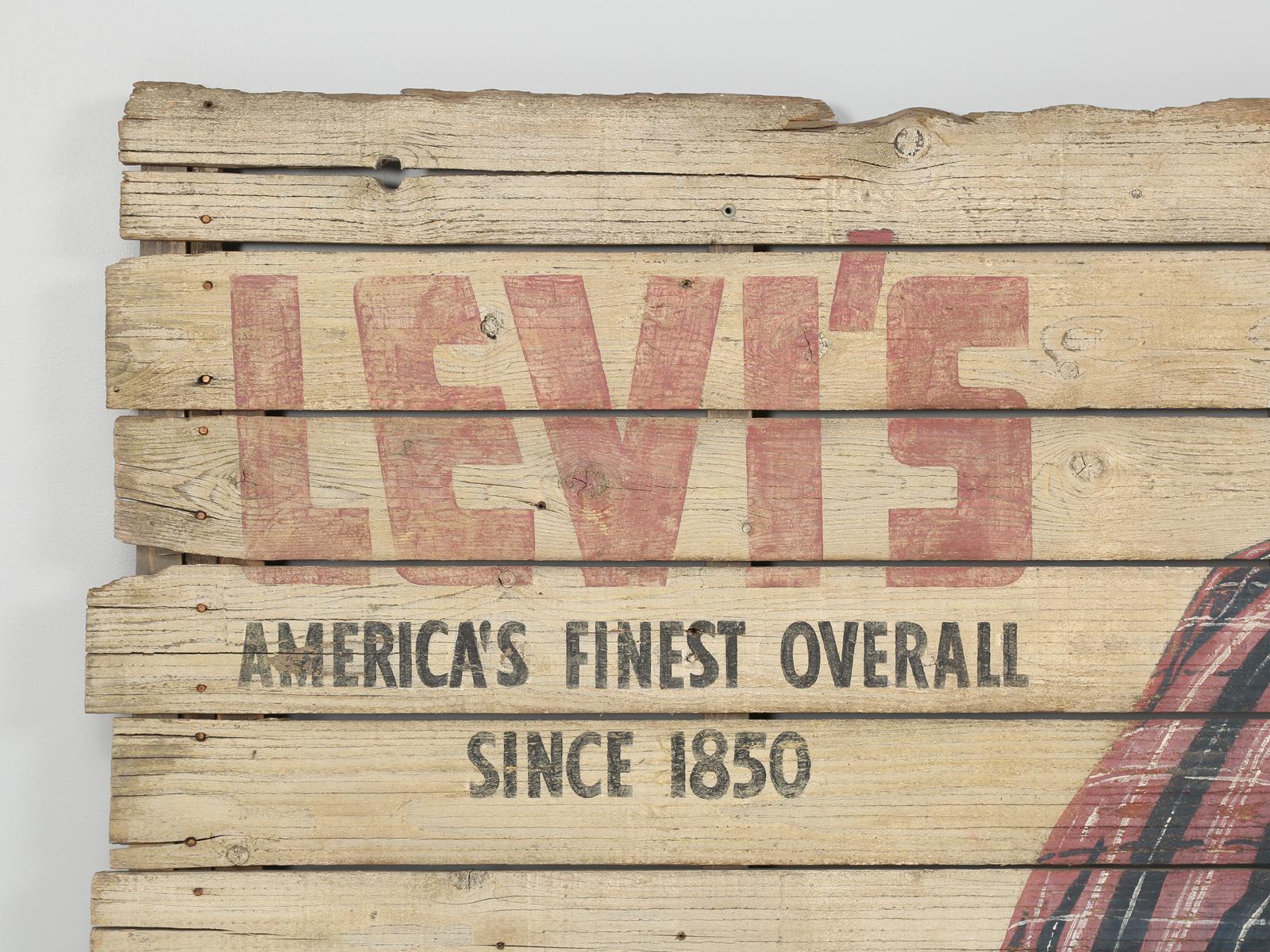 “The West’s most famous brand.” Levi’s America’s finest overall since 1850.

We have been purchasing vintage commercial signs for over 30 years, and we have never discovered one of such grand proportions with such incredible subject matter. What is