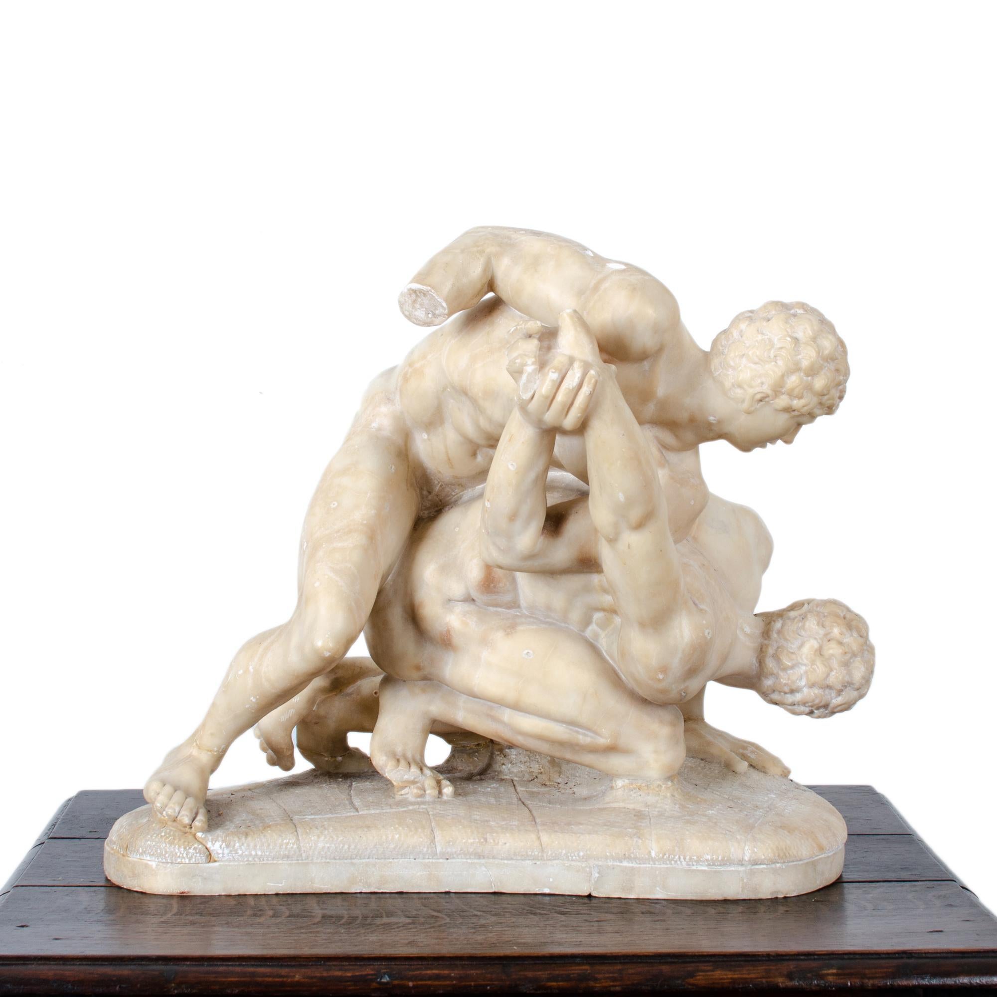 Los Luchadores, también conocidos como Los Pancrastinae, según la copia romana del siglo I del original griego conservado en la colección Uffizi de Florencia. 

Mármol, fabricado en Italia hacia la década de 1870. 

20 pulgadas de ancho por 10
