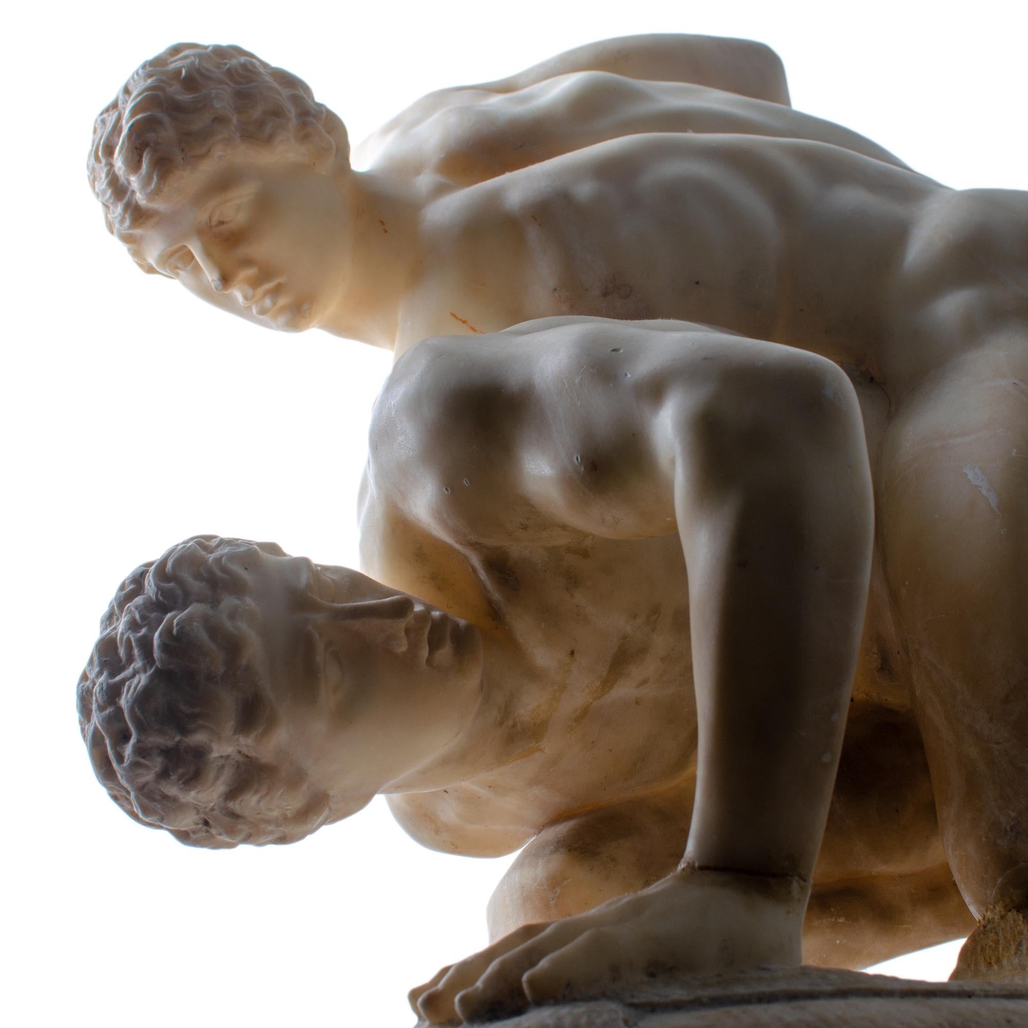 los luchadores escultura