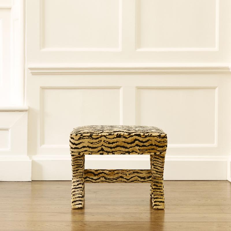 Fully upholstered from top to bottom, the X-Frame Stool is the perfect addition to any space. Use it in your entryway as a perch to take shoes off/put shoes on, or place it at the end of the bed.

Upholstered here in a tiger-skin pattern,