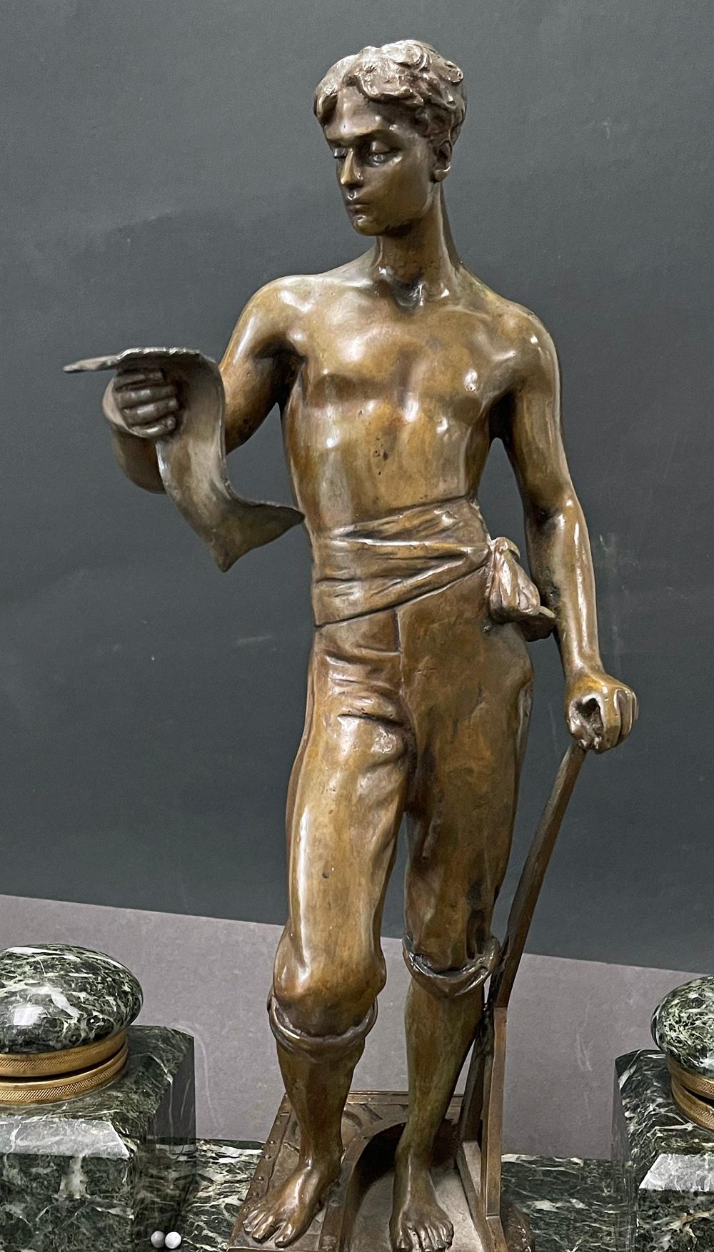 Rare and monumental, this bronze and marble inkwell and pen tray -- over 15 inches tall -- was clearly commissioned by a wealthy architect- businessman with a richly-outfitted desk and office space. The central bronze figure is a youthful architect,