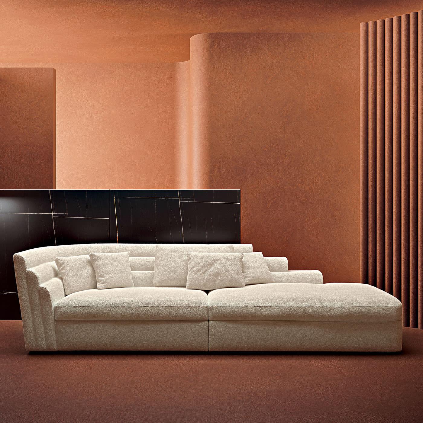 Sofa featuring an iconic design. With a system composed of single elements and various modular elements and a structure in wood covered with a layer of polyurethane of different densities. The maximum comfort of the seat is determined by a weave of