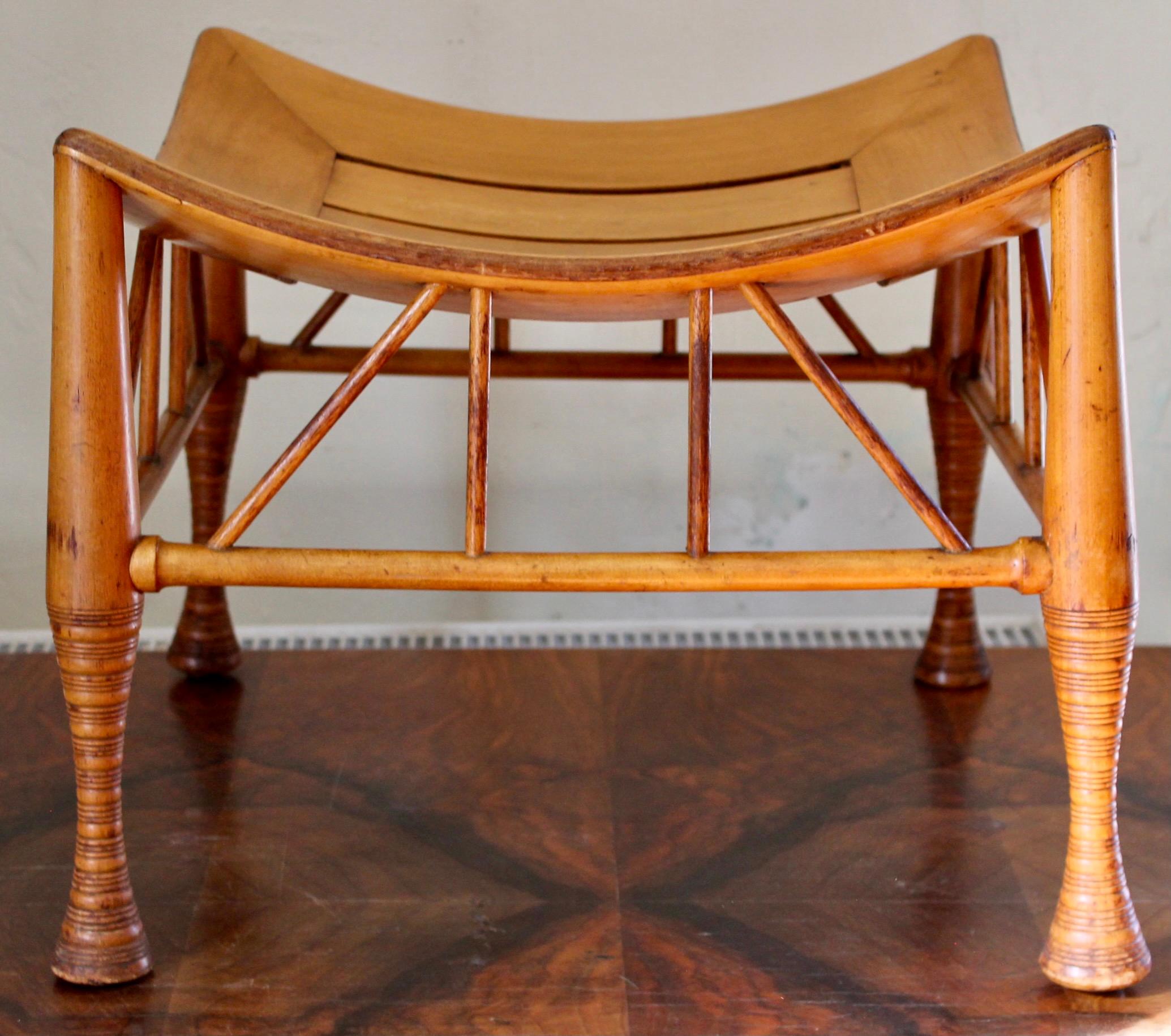 A highly developed and detailed period version of the Classic Thebes Stool.
Turned and joined in a blond fruitwood. The surface is a very attractive original high and untouched sheen.