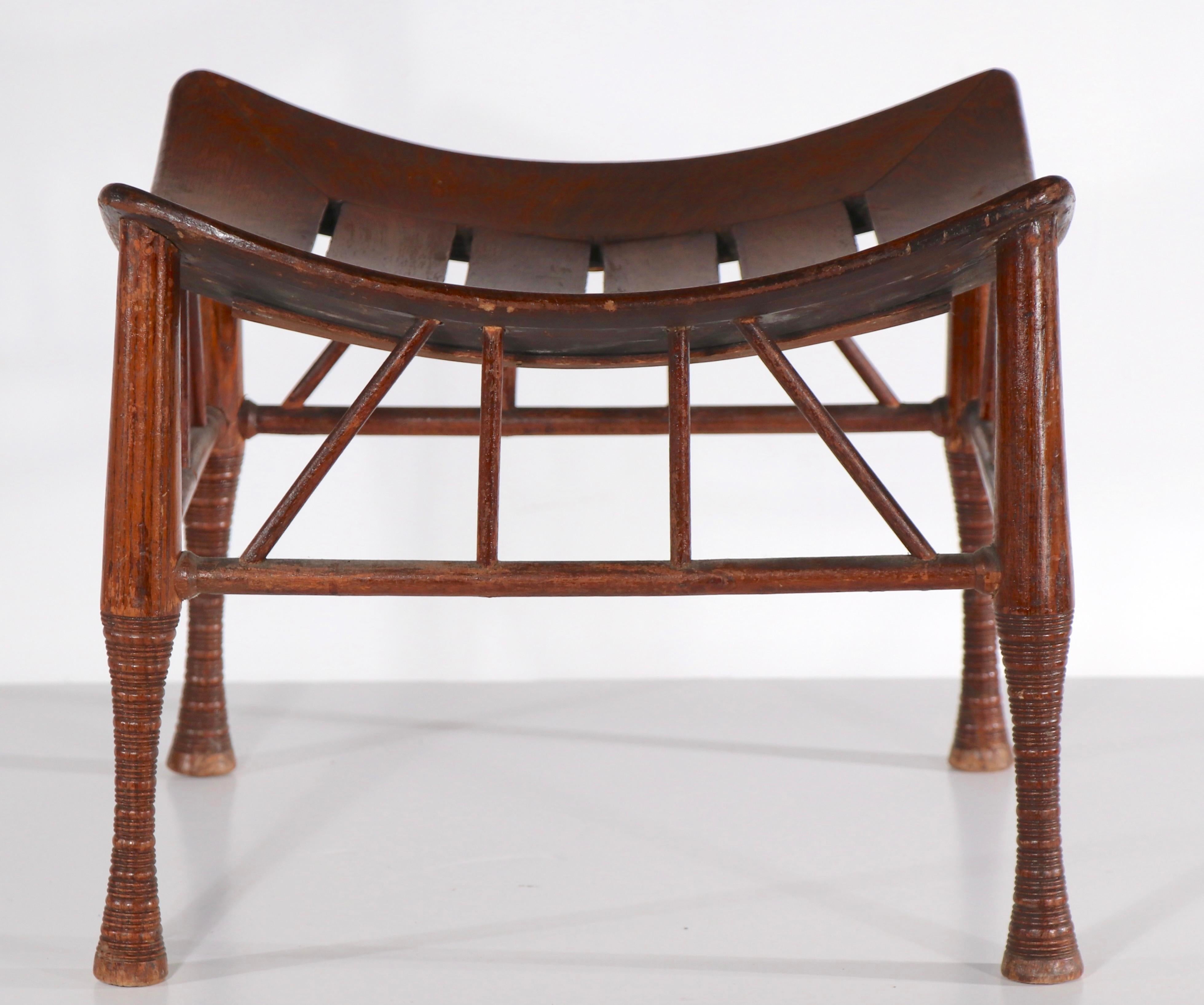 Interesting architectural Thebes stool, probably English circa 1930’s.
Sculptural form, original finish, solid sturdy and ready to use, the stool shows an old repair on the underside of the seat, please see images.
 