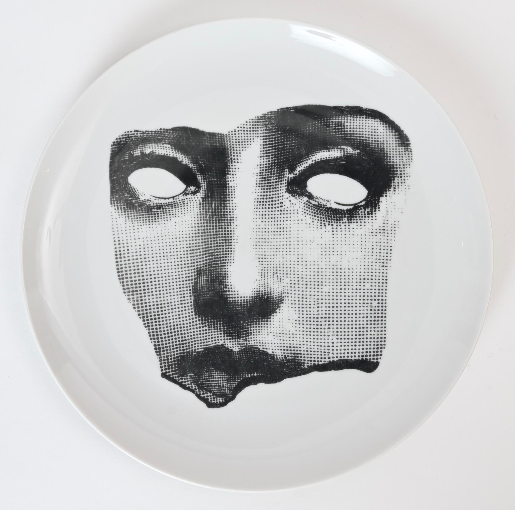 A beautiful black and white ceramic plate by Piero Fornasetti featuring Lina Calvalieri as a broken fragment. Number '64' in the Themes and Variations series, this plate is a rare, early 1960s production from the Milanese atelier.


 