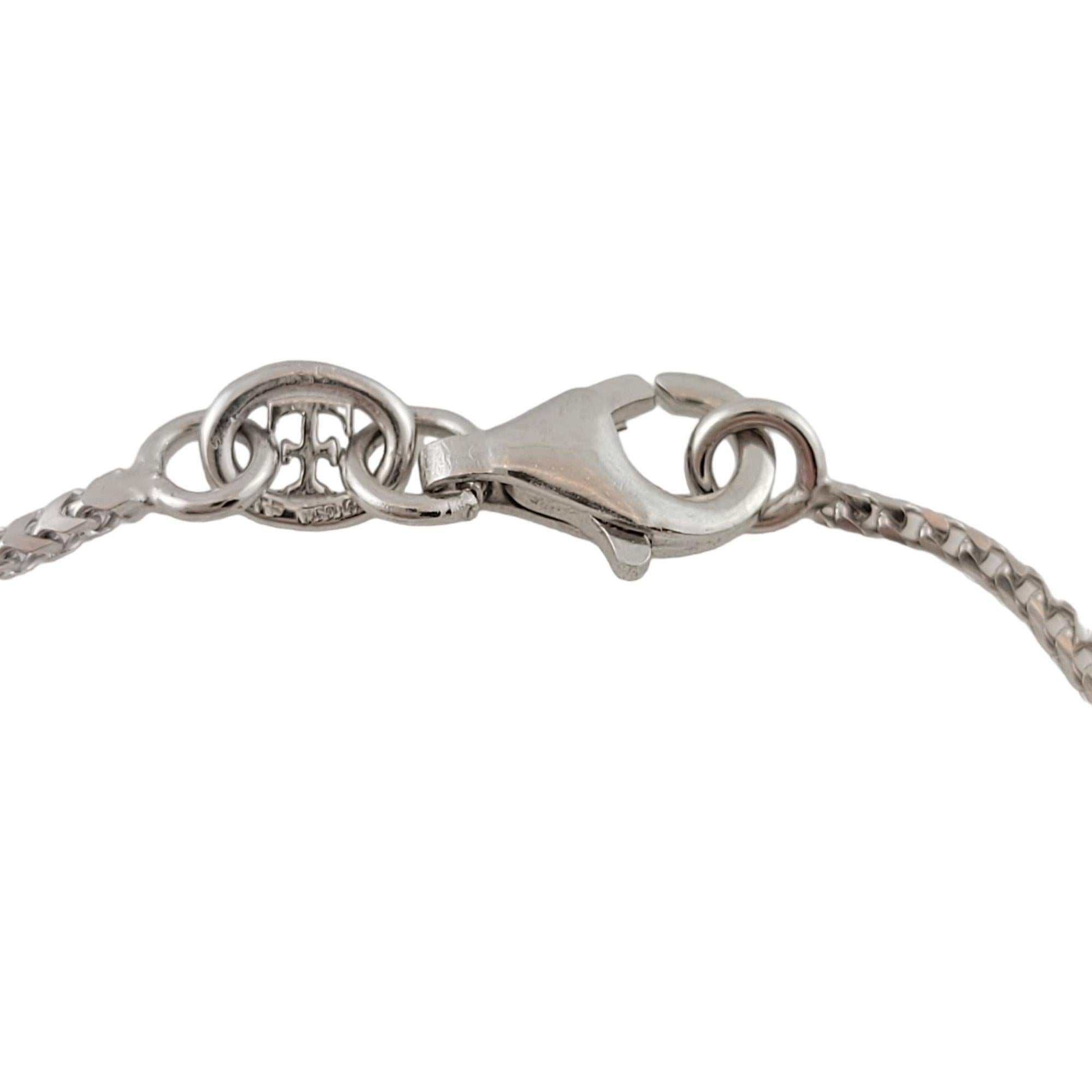 Vintage Theo Fennell 18 Karat White Gold and Diamond Cross Pendant Necklace-

This lovely cross pendant necklace features one round brilliant cut diamond set in beautifully detailed 18K white gold.

Size: 16 inches (necklace)
29 mm x 15 mm
